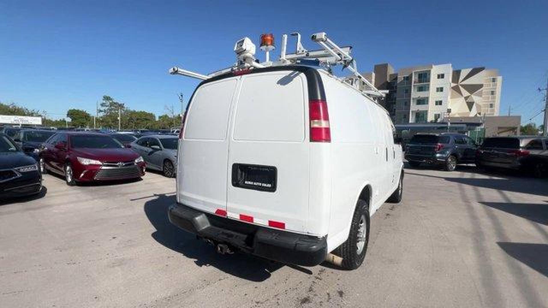 2015 Summit White /Medium Pewter Chevrolet Express Cargo Van (1GCWGFCF3F1) with an 8 4.8L engine, Automatic transmission, located at 27610 S Dixie Hwy, Homestead, FL, 33032, (305) 749-2348, 25.510241, -80.438301 - This Chevrolet Express Cargo Van delivers a Gas V8 4.8L/293 engine powering this Automatic transmission. TRANSMISSION, 6-SPEED AUTOMATIC, HEAVY-DUTY, ELECTRONICALLY CONTROLLED with overdrive tow/haul mode and internal transmission oil cooler (STD), TRAILERING EQUIPMENT, HEAVY-DUTY includes trailerin - Photo#4