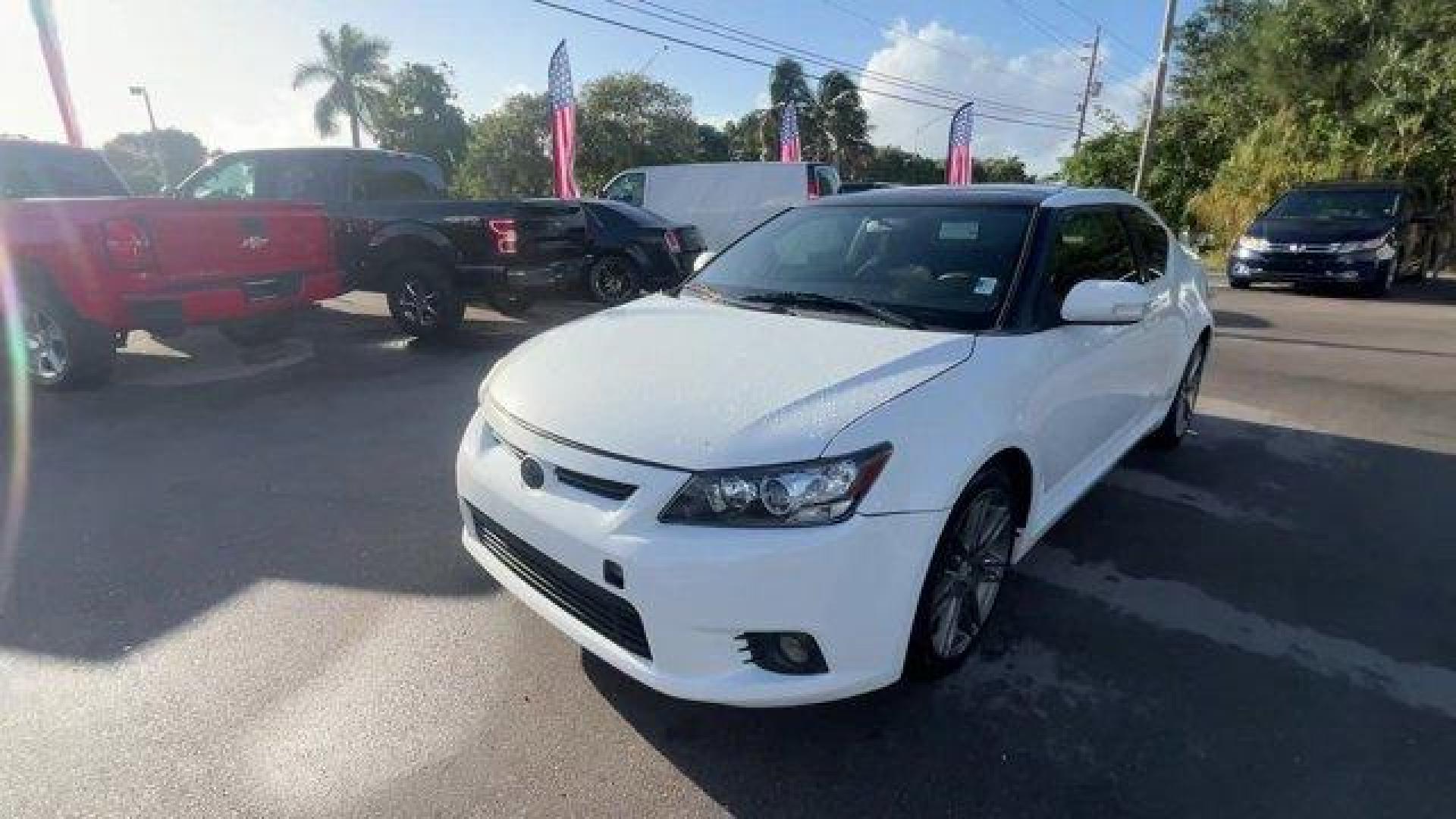 2013 White Scion tC (JTKJF5C75D3) with an 4 2.5L engine, Automatic transmission, located at 27610 S Dixie Hwy, Homestead, FL, 33032, (305) 749-2348, 25.510241, -80.438301 - IIHS Top Safety Pick. Only 122,737 Miles! Scores 31 Highway MPG and 23 City MPG! This Scion tC boasts a Gas I4 2.5L/152 engine powering this Automatic transmission. Vehicle stability control (VSC), Variable intermittent windshield wipers, Traction control.* This Scion tC Features the Following Optio - Photo#0