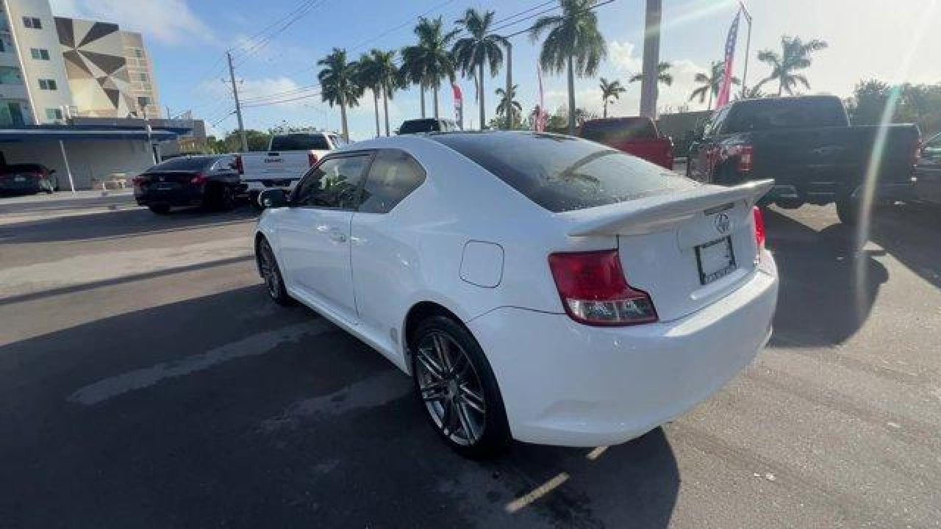 2013 White Scion tC (JTKJF5C75D3) with an 4 2.5L engine, Automatic transmission, located at 27610 S Dixie Hwy, Homestead, FL, 33032, (305) 749-2348, 25.510241, -80.438301 - IIHS Top Safety Pick. Only 122,737 Miles! Scores 31 Highway MPG and 23 City MPG! This Scion tC boasts a Gas I4 2.5L/152 engine powering this Automatic transmission. Vehicle stability control (VSC), Variable intermittent windshield wipers, Traction control.* This Scion tC Features the Following Optio - Photo#2