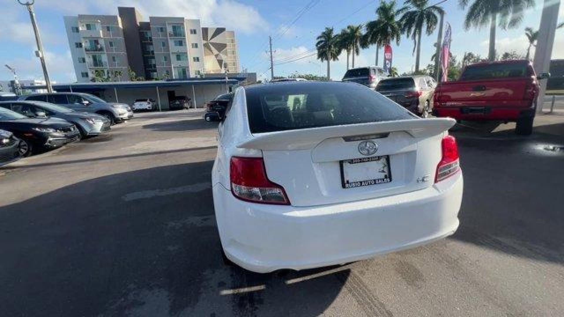 2013 White Scion tC (JTKJF5C75D3) with an 4 2.5L engine, Automatic transmission, located at 27610 S Dixie Hwy, Homestead, FL, 33032, (305) 749-2348, 25.510241, -80.438301 - IIHS Top Safety Pick. Only 122,737 Miles! Scores 31 Highway MPG and 23 City MPG! This Scion tC boasts a Gas I4 2.5L/152 engine powering this Automatic transmission. Vehicle stability control (VSC), Variable intermittent windshield wipers, Traction control.* This Scion tC Features the Following Optio - Photo#3