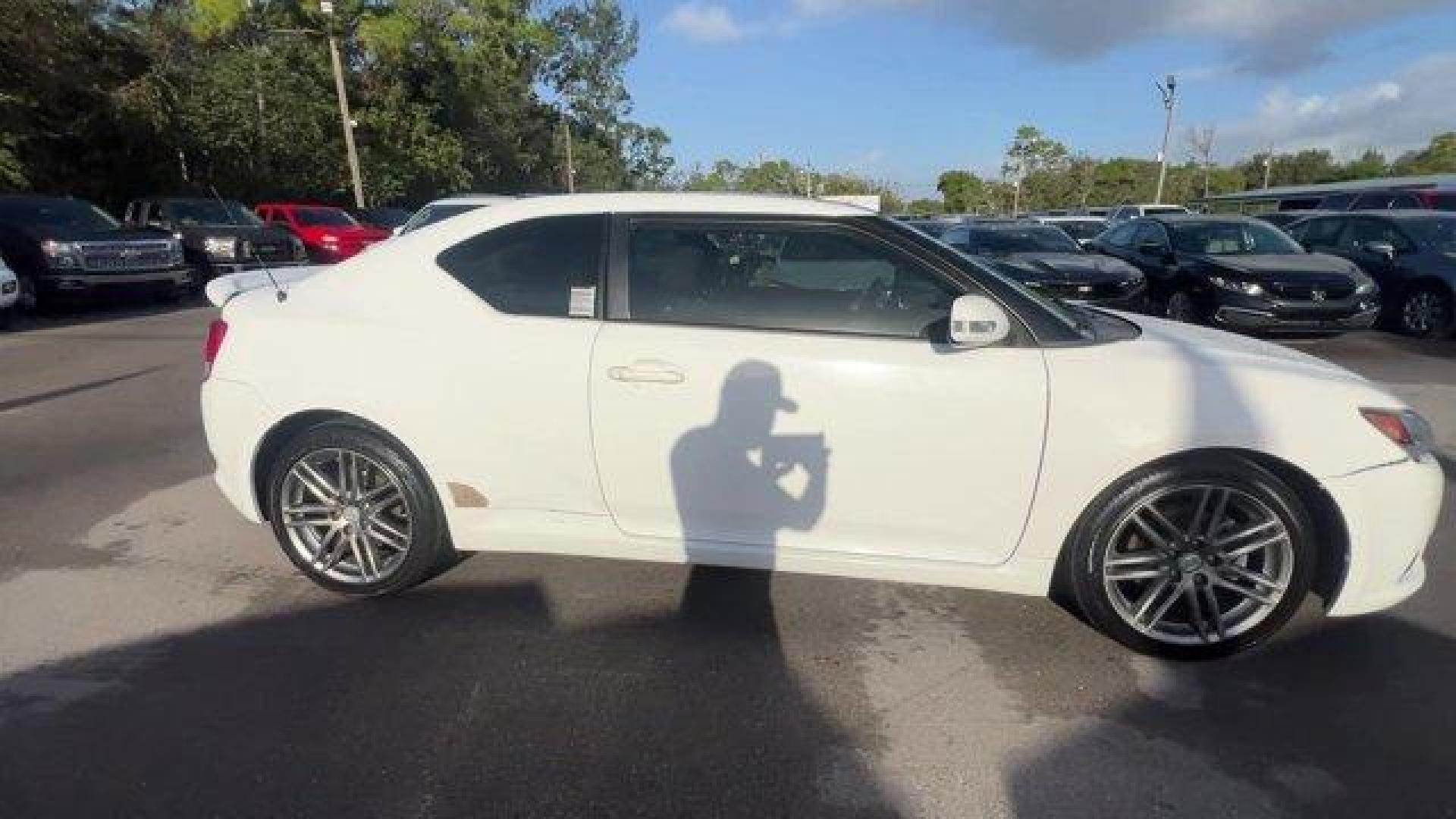 2013 White Scion tC (JTKJF5C75D3) with an 4 2.5L engine, Automatic transmission, located at 27610 S Dixie Hwy, Homestead, FL, 33032, (305) 749-2348, 25.510241, -80.438301 - IIHS Top Safety Pick. Only 122,737 Miles! Scores 31 Highway MPG and 23 City MPG! This Scion tC boasts a Gas I4 2.5L/152 engine powering this Automatic transmission. Vehicle stability control (VSC), Variable intermittent windshield wipers, Traction control.* This Scion tC Features the Following Optio - Photo#5