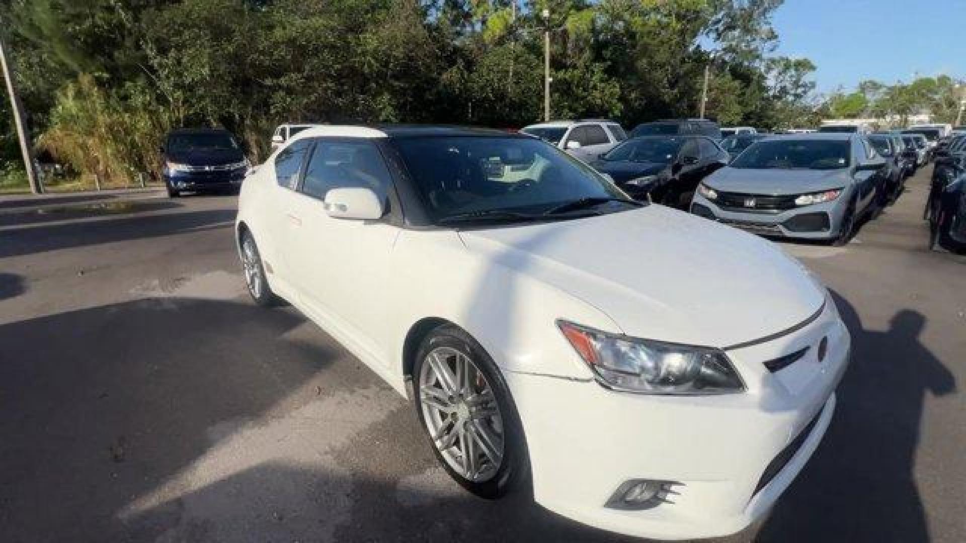 2013 White Scion tC (JTKJF5C75D3) with an 4 2.5L engine, Automatic transmission, located at 27610 S Dixie Hwy, Homestead, FL, 33032, (305) 749-2348, 25.510241, -80.438301 - IIHS Top Safety Pick. Only 122,737 Miles! Scores 31 Highway MPG and 23 City MPG! This Scion tC boasts a Gas I4 2.5L/152 engine powering this Automatic transmission. Vehicle stability control (VSC), Variable intermittent windshield wipers, Traction control.* This Scion tC Features the Following Optio - Photo#6