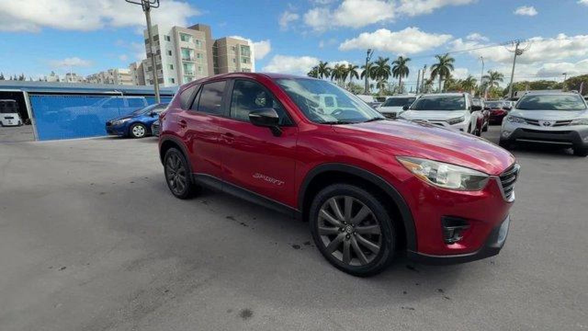 2016 Soul Red Metallic /Black Mazda CX-5 (JM3KE2CY4G0) with an 4 2.5 L engine, Automatic transmission, located at 27610 S Dixie Hwy, Homestead, FL, 33032, (305) 749-2348, 25.510241, -80.438301 - Only 10,120 Miles! Boasts 33 Highway MPG and 26 City MPG! This Mazda CX-5 delivers a Regular Unleaded I-4 2.5 L/152 engine powering this Automatic transmission. SOUL RED METALLIC PAINT, SOUL RED METALLIC, BLACK, CLOTH SEAT TRIM.*This Mazda CX-5 Comes Equipped with These Options *Wheels: 17 x 7J Alum - Photo#6