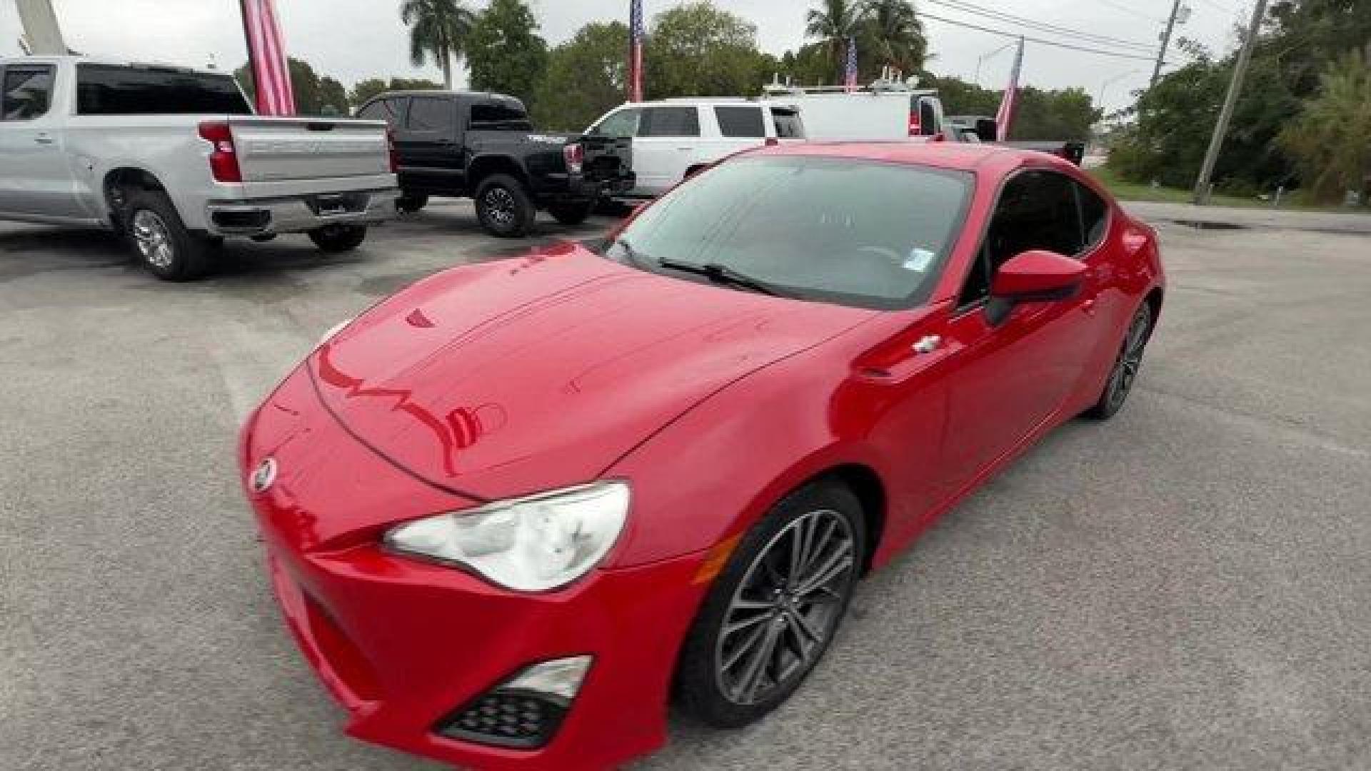 2015 Red Scion FR-S (JF1ZNAA12F8) with an 4 2.0 L engine, Automatic transmission, located at 27610 S Dixie Hwy, Homestead, FL, 33032, (305) 749-2348, 25.510241, -80.438301 - Scores 34 Highway MPG and 25 City MPG! This Scion FR-S delivers a Premium Unleaded H-4 2.0 L/122 engine powering this Automatic transmission. Wheels: 17 x 7 Alloy, Variable Intermittent Wipers, Valet Function.*This Scion FR-S Comes Equipped with These Options *Trunk Rear Cargo Access, Trip Computer, - Photo#0