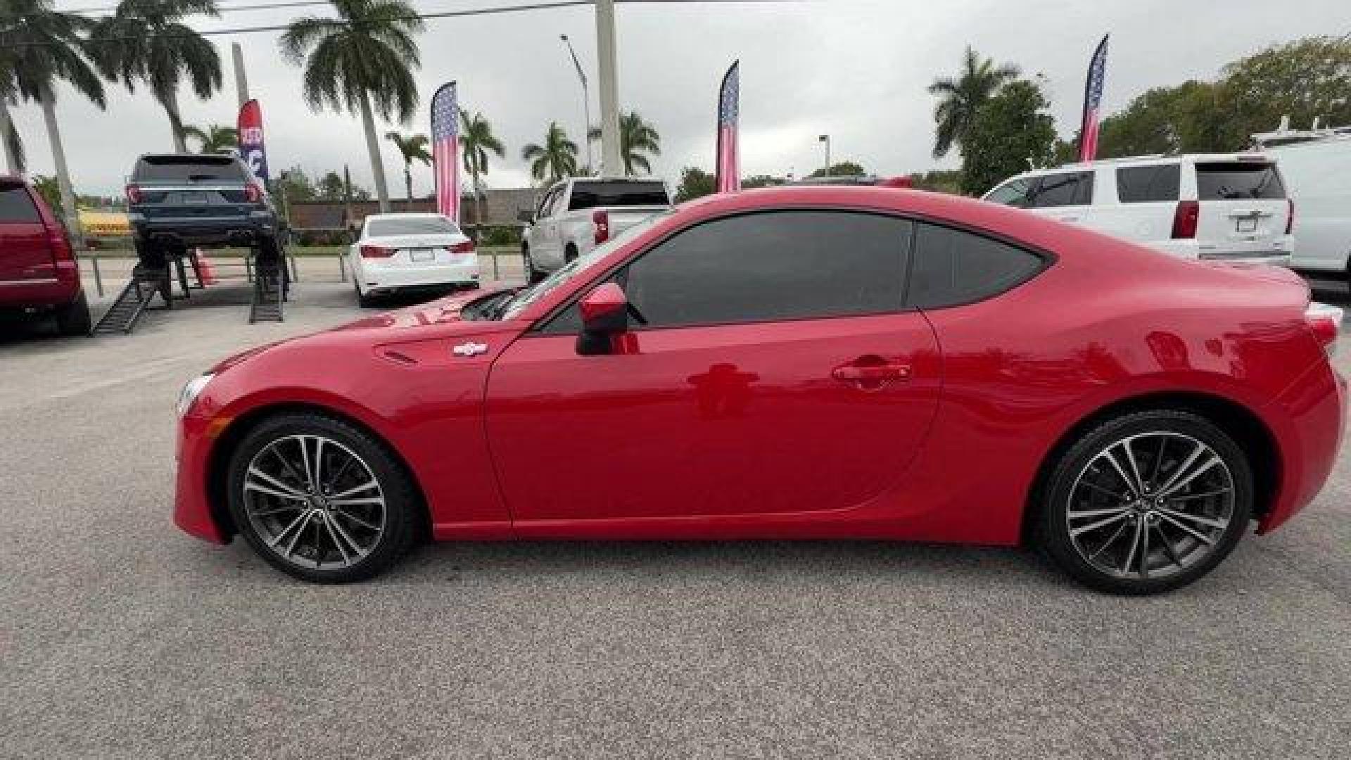 2015 Red Scion FR-S (JF1ZNAA12F8) with an 4 2.0 L engine, Automatic transmission, located at 27610 S Dixie Hwy, Homestead, FL, 33032, (305) 749-2348, 25.510241, -80.438301 - Scores 34 Highway MPG and 25 City MPG! This Scion FR-S delivers a Premium Unleaded H-4 2.0 L/122 engine powering this Automatic transmission. Wheels: 17 x 7 Alloy, Variable Intermittent Wipers, Valet Function.*This Scion FR-S Comes Equipped with These Options *Trunk Rear Cargo Access, Trip Computer, - Photo#1