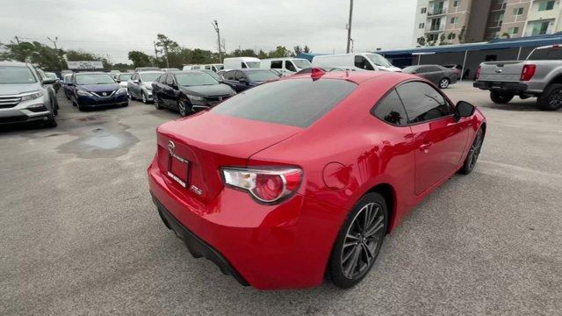 2015 Red Scion FR-S (JF1ZNAA12F8) with an 4 2.0 L engine, Automatic transmission, located at 27610 S Dixie Hwy, Homestead, FL, 33032, (305) 749-2348, 25.510241, -80.438301 - Scores 34 Highway MPG and 25 City MPG! This Scion FR-S delivers a Premium Unleaded H-4 2.0 L/122 engine powering this Automatic transmission. Wheels: 17 x 7 Alloy, Variable Intermittent Wipers, Valet Function.*This Scion FR-S Comes Equipped with These Options *Trunk Rear Cargo Access, Trip Computer, - Photo#4