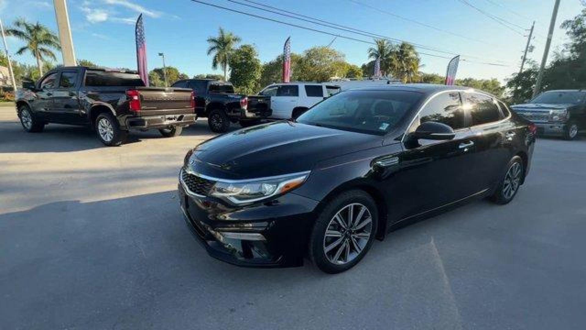 2019 Ebony Black /Black Kia Optima (5XXGT4L38KG) with an 4 2.4 L engine, Automatic transmission, located at 27610 S Dixie Hwy, Homestead, FL, 33032, (305) 749-2348, 25.510241, -80.438301 - KBB.com 10 Best Sedans Under $30,000. Boasts 33 Highway MPG and 24 City MPG! This Kia Optima boasts a Regular Unleaded I-4 2.4 L/144 engine powering this Automatic transmission. REAR BUMPER APPLIQUE, LX PREMIUM PACKAGE -inc: Gloss Black Door Pillars, 10-Way Power Adjustable Driver's Seat, 2-way powe - Photo#0