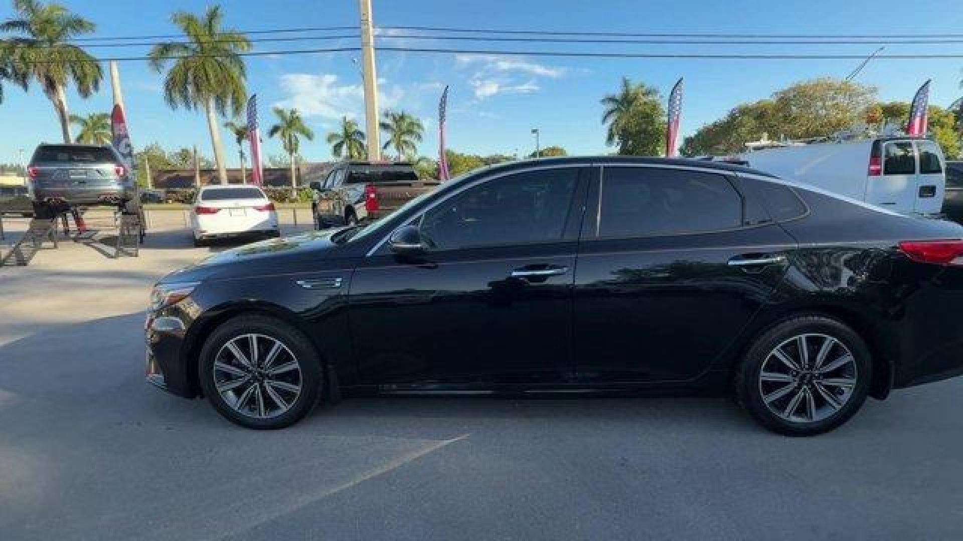 2019 Ebony Black /Black Kia Optima (5XXGT4L38KG) with an 4 2.4 L engine, Automatic transmission, located at 27610 S Dixie Hwy, Homestead, FL, 33032, (305) 749-2348, 25.510241, -80.438301 - KBB.com 10 Best Sedans Under $30,000. Boasts 33 Highway MPG and 24 City MPG! This Kia Optima boasts a Regular Unleaded I-4 2.4 L/144 engine powering this Automatic transmission. REAR BUMPER APPLIQUE, LX PREMIUM PACKAGE -inc: Gloss Black Door Pillars, 10-Way Power Adjustable Driver's Seat, 2-way powe - Photo#1