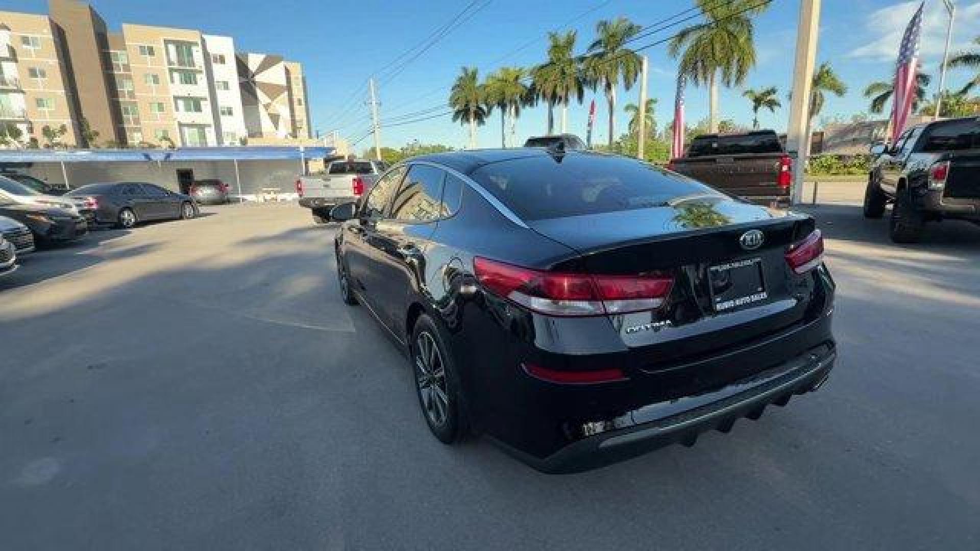 2019 Ebony Black /Black Kia Optima (5XXGT4L38KG) with an 4 2.4 L engine, Automatic transmission, located at 27610 S Dixie Hwy, Homestead, FL, 33032, (305) 749-2348, 25.510241, -80.438301 - KBB.com 10 Best Sedans Under $30,000. Boasts 33 Highway MPG and 24 City MPG! This Kia Optima boasts a Regular Unleaded I-4 2.4 L/144 engine powering this Automatic transmission. REAR BUMPER APPLIQUE, LX PREMIUM PACKAGE -inc: Gloss Black Door Pillars, 10-Way Power Adjustable Driver's Seat, 2-way powe - Photo#2