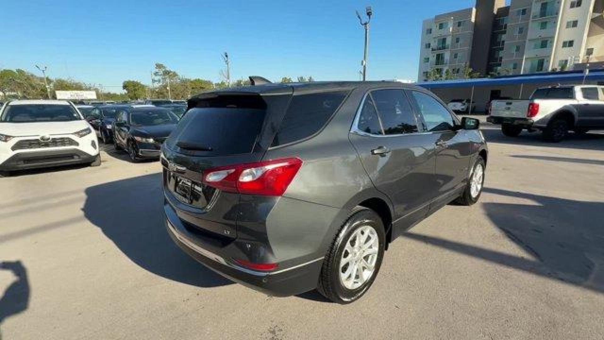 2020 Nightfall Gray Metallic /Jet Black Chevrolet Equinox (2GNAXJEV1L6) with an 4 1.5L engine, Automatic transmission, located at 27610 S Dixie Hwy, Homestead, FL, 33032, (305) 749-2348, 25.510241, -80.438301 - IIHS Top Safety Pick with specific headlights. Scores 31 Highway MPG and 26 City MPG! This Chevrolet Equinox boasts a Turbocharged Gas I4 1.5L/92 engine powering this Automatic transmission. UNIVERSAL HOME REMOTE includes garage door opener, programmable, TRANSMISSION, 6-SPEED AUTOMATIC, ELECTRONICA - Photo#4