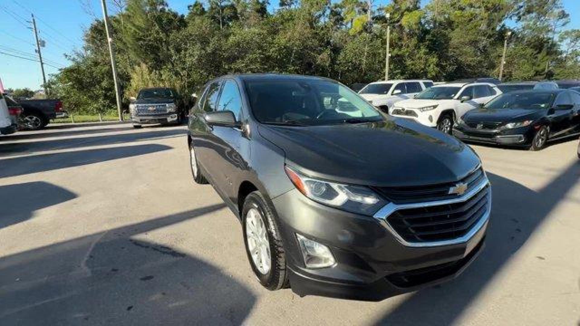 2020 Nightfall Gray Metallic /Jet Black Chevrolet Equinox (2GNAXJEV1L6) with an 4 1.5L engine, Automatic transmission, located at 27610 S Dixie Hwy, Homestead, FL, 33032, (305) 749-2348, 25.510241, -80.438301 - IIHS Top Safety Pick with specific headlights. Scores 31 Highway MPG and 26 City MPG! This Chevrolet Equinox boasts a Turbocharged Gas I4 1.5L/92 engine powering this Automatic transmission. UNIVERSAL HOME REMOTE includes garage door opener, programmable, TRANSMISSION, 6-SPEED AUTOMATIC, ELECTRONICA - Photo#6