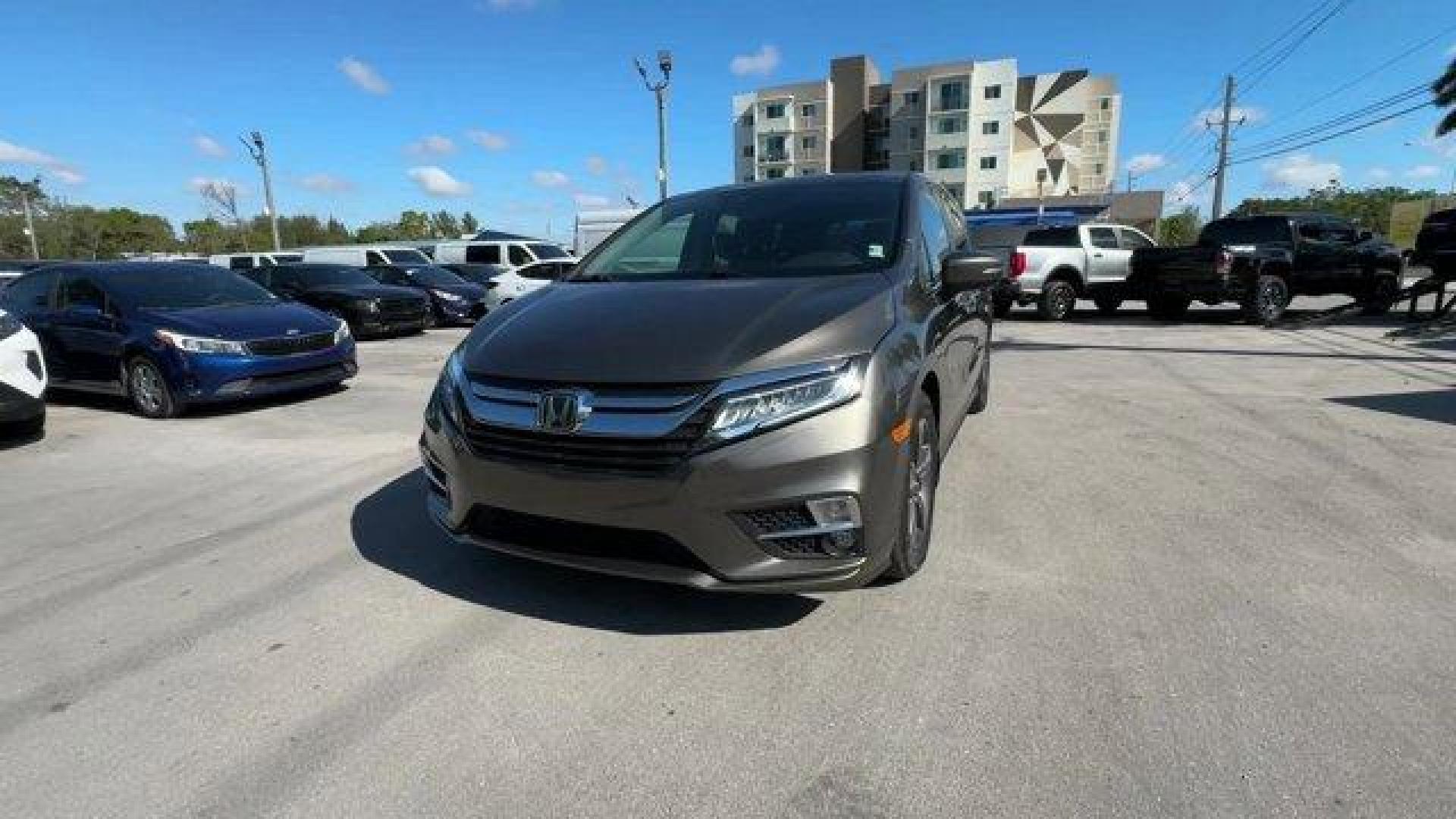 2020 Gray Honda Odyssey (5FNRL6H89LB) with an 6 3.5 L engine, Automatic transmission, located at 27610 S Dixie Hwy, Homestead, FL, 33032, (305) 749-2348, 25.510241, -80.438301 - ALG Residual Value Awards, Residual Value Awards. Delivers 28 Highway MPG and 19 City MPG! This Honda Odyssey boasts a Regular Unleaded V-6 3.5 L/212 engine powering this Automatic transmission. Wheels: 18 Machine-Finished Alloy -inc: dark gray insert, VSA Electronic Stability Control (ESC), Vinyl D - Photo#0