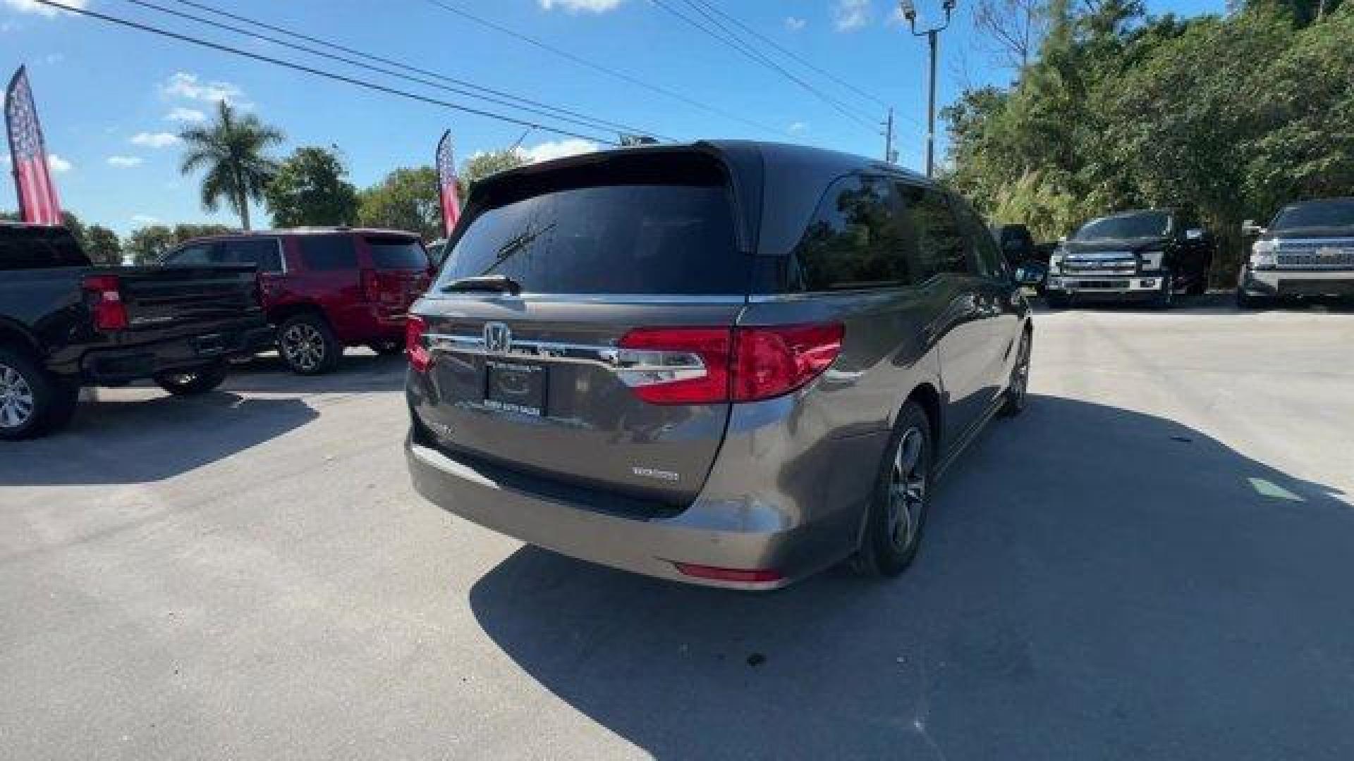 2020 Gray Honda Odyssey (5FNRL6H89LB) with an 6 3.5 L engine, Automatic transmission, located at 27610 S Dixie Hwy, Homestead, FL, 33032, (305) 749-2348, 25.510241, -80.438301 - ALG Residual Value Awards, Residual Value Awards. Delivers 28 Highway MPG and 19 City MPG! This Honda Odyssey boasts a Regular Unleaded V-6 3.5 L/212 engine powering this Automatic transmission. Wheels: 18 Machine-Finished Alloy -inc: dark gray insert, VSA Electronic Stability Control (ESC), Vinyl D - Photo#4