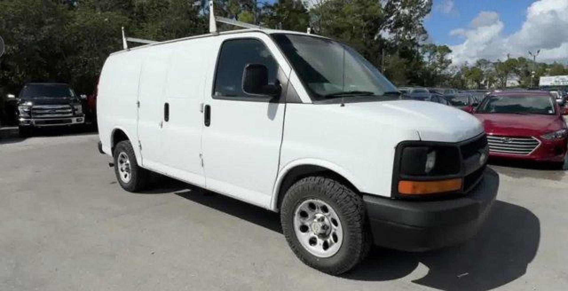 2013 Summit White /Medium Pewter Chevrolet Express Cargo Van (1GCSGAFX1D1) with an 6 4.3L engine, Automatic transmission, located at 27610 S Dixie Hwy, Homestead, FL, 33032, (305) 749-2348, 25.510241, -80.438301 - Delivers 20 Highway MPG and 15 City MPG! This Chevrolet Express Cargo Van delivers a Gas V6 4.3L/262 engine powering this Automatic transmission. TRANSMISSION, 4-SPEED AUTOMATIC, ELECTRONICALLY CONTROLLED with overdrive, tow/haul mode and internal transmission oil cooler (STD), TIRE, SPARE P245/70R1 - Photo#0