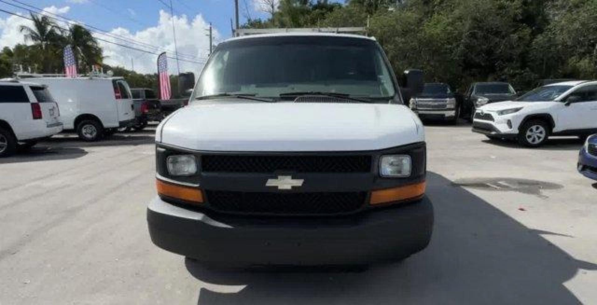 2013 Summit White /Medium Pewter Chevrolet Express Cargo Van (1GCSGAFX1D1) with an 6 4.3L engine, Automatic transmission, located at 27610 S Dixie Hwy, Homestead, FL, 33032, (305) 749-2348, 25.510241, -80.438301 - Delivers 20 Highway MPG and 15 City MPG! This Chevrolet Express Cargo Van delivers a Gas V6 4.3L/262 engine powering this Automatic transmission. TRANSMISSION, 4-SPEED AUTOMATIC, ELECTRONICALLY CONTROLLED with overdrive, tow/haul mode and internal transmission oil cooler (STD), TIRE, SPARE P245/70R1 - Photo#1