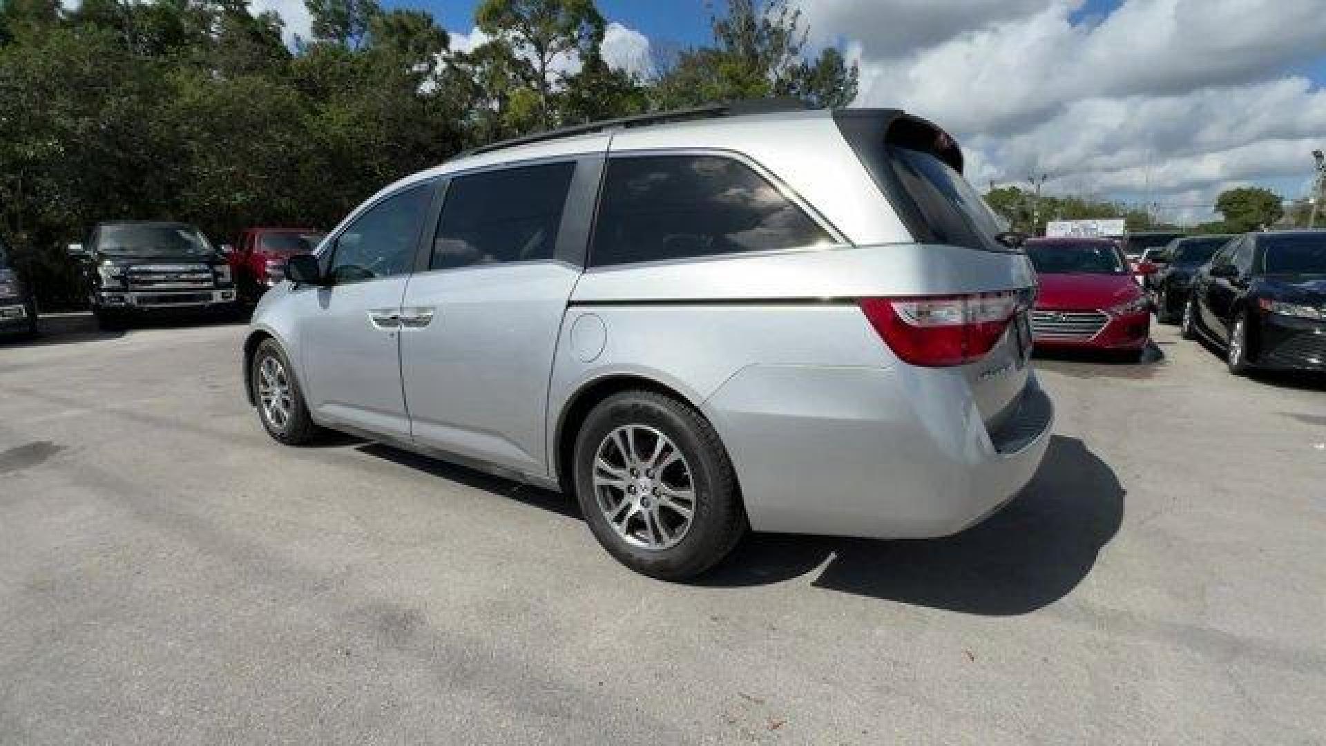 2012 Silver Honda Odyssey (5FNRL5H64CB) with an 6 3.5L engine, Automatic transmission, located at 27610 S Dixie Hwy, Homestead, FL, 33032, (305) 749-2348, 25.510241, -80.438301 - KBB.com 10 Best Used Family Cars Under $15,000. Scores 27 Highway MPG and 18 City MPG! This Honda Odyssey delivers a Gas V6 3.5L/212 engine powering this Automatic transmission. XM Radio (subscription required), Wide-mode adjustable 2nd-row seats -inc: leather trimmed outboard seats, multi-function - Photo#2