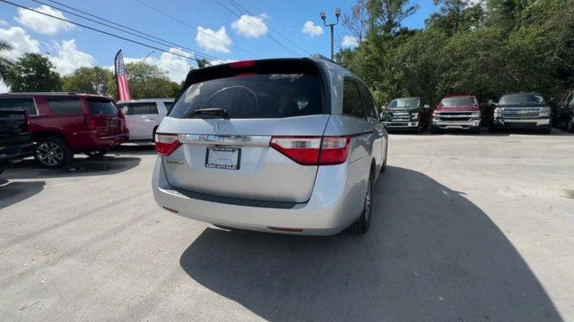 2012 Silver Honda Odyssey (5FNRL5H64CB) with an 6 3.5L engine, Automatic transmission, located at 27610 S Dixie Hwy, Homestead, FL, 33032, (305) 749-2348, 25.510241, -80.438301 - KBB.com 10 Best Used Family Cars Under $15,000. Scores 27 Highway MPG and 18 City MPG! This Honda Odyssey delivers a Gas V6 3.5L/212 engine powering this Automatic transmission. XM Radio (subscription required), Wide-mode adjustable 2nd-row seats -inc: leather trimmed outboard seats, multi-function - Photo#4