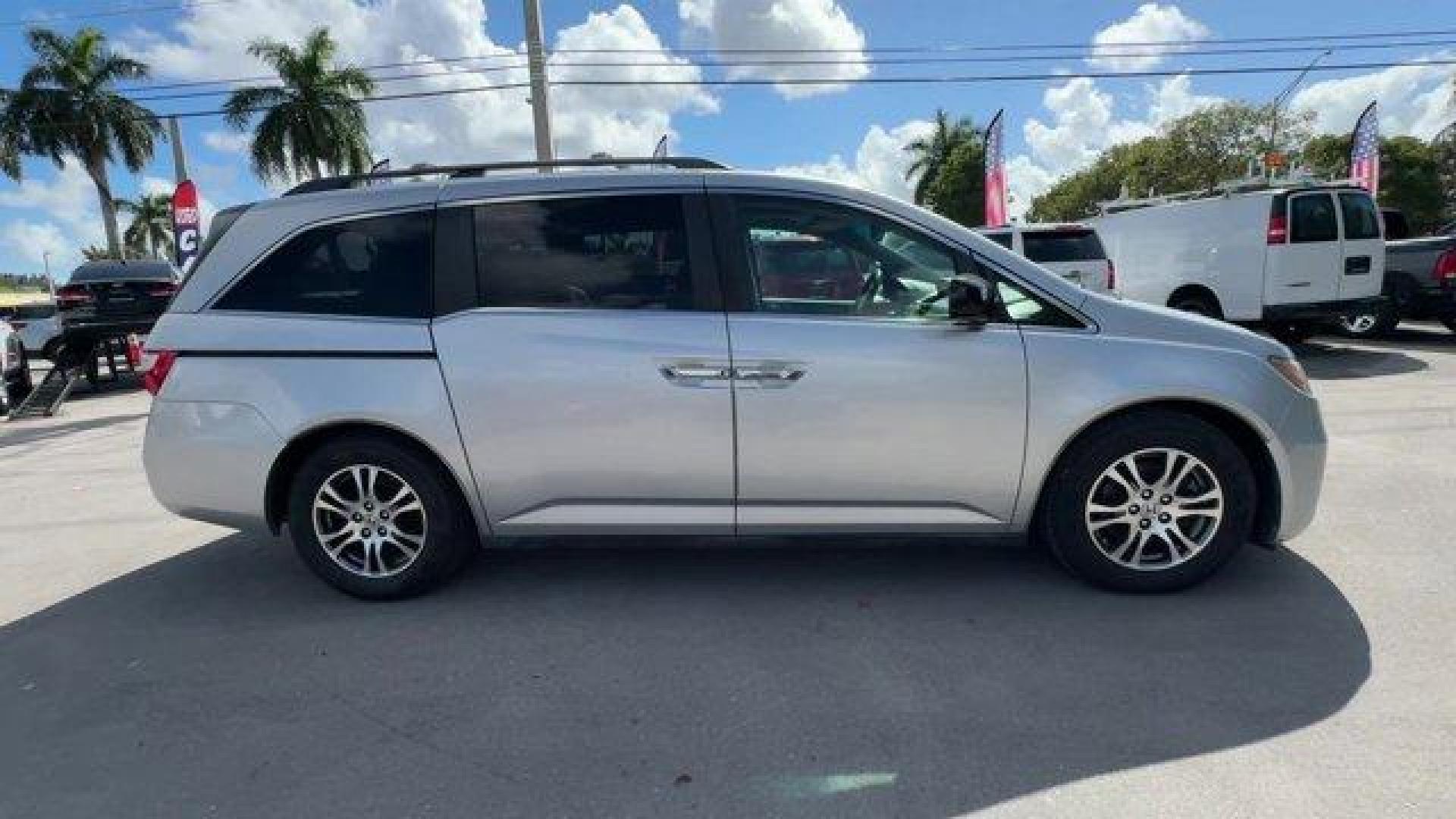 2012 Silver Honda Odyssey (5FNRL5H64CB) with an 6 3.5L engine, Automatic transmission, located at 27610 S Dixie Hwy, Homestead, FL, 33032, (305) 749-2348, 25.510241, -80.438301 - KBB.com 10 Best Used Family Cars Under $15,000. Scores 27 Highway MPG and 18 City MPG! This Honda Odyssey delivers a Gas V6 3.5L/212 engine powering this Automatic transmission. XM Radio (subscription required), Wide-mode adjustable 2nd-row seats -inc: leather trimmed outboard seats, multi-function - Photo#5