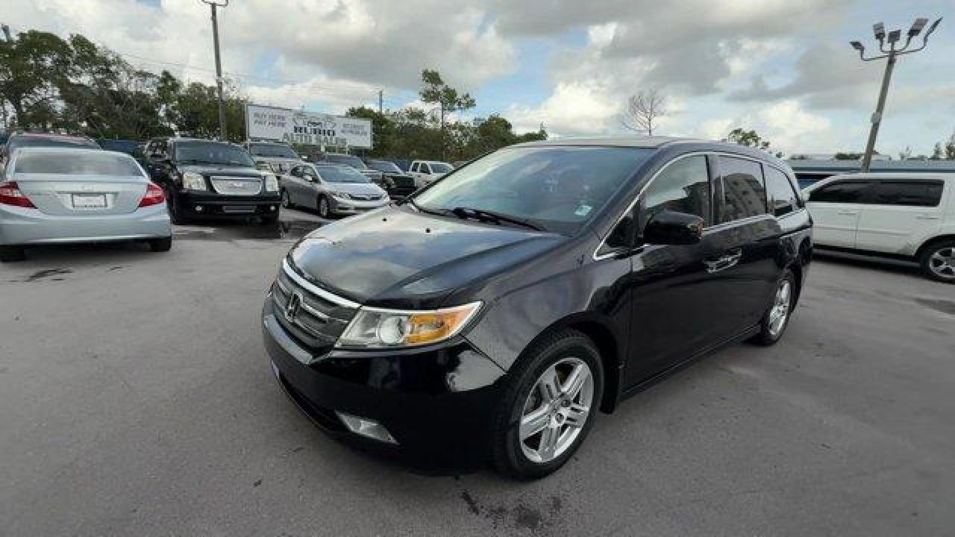 2013 Black Honda Odyssey (5FNRL5H97DB) with an 6 3.5L engine, Automatic transmission, located at 27610 S Dixie Hwy, Homestead, FL, 33032, (305) 749-2348, 25.510241, -80.438301 - KBB.com 10 Best Family Cars. Only 119,824 Miles! Boasts 28 Highway MPG and 19 City MPG! This Honda Odyssey boasts a Gas V6 3.5L/212 engine powering this Automatic transmission. XM Radio (subscription required), Wide-mode adjustable 2nd-row seats -inc: leather trimmed outboard seats, multi-function c - Photo#0