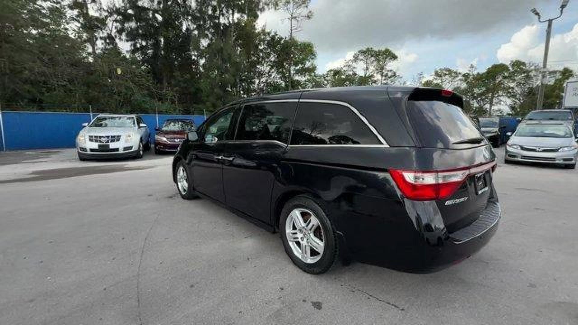 2013 Black Honda Odyssey (5FNRL5H97DB) with an 6 3.5L engine, Automatic transmission, located at 27610 S Dixie Hwy, Homestead, FL, 33032, (305) 749-2348, 25.510241, -80.438301 - KBB.com 10 Best Family Cars. Only 119,824 Miles! Boasts 28 Highway MPG and 19 City MPG! This Honda Odyssey boasts a Gas V6 3.5L/212 engine powering this Automatic transmission. XM Radio (subscription required), Wide-mode adjustable 2nd-row seats -inc: leather trimmed outboard seats, multi-function c - Photo#2