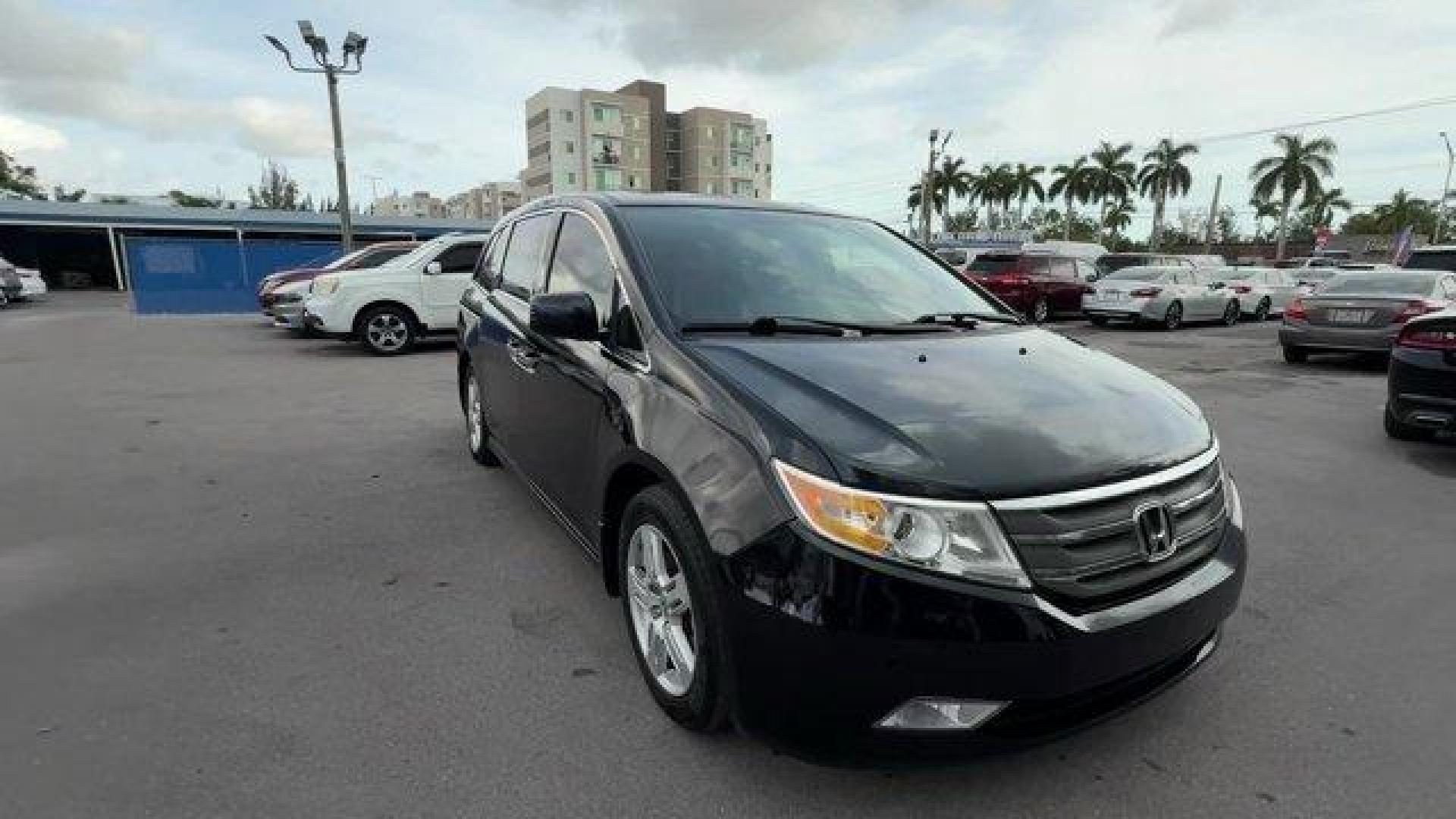 2013 Black Honda Odyssey (5FNRL5H97DB) with an 6 3.5L engine, Automatic transmission, located at 27610 S Dixie Hwy, Homestead, FL, 33032, (305) 749-2348, 25.510241, -80.438301 - KBB.com 10 Best Family Cars. Only 119,824 Miles! Boasts 28 Highway MPG and 19 City MPG! This Honda Odyssey boasts a Gas V6 3.5L/212 engine powering this Automatic transmission. XM Radio (subscription required), Wide-mode adjustable 2nd-row seats -inc: leather trimmed outboard seats, multi-function c - Photo#6