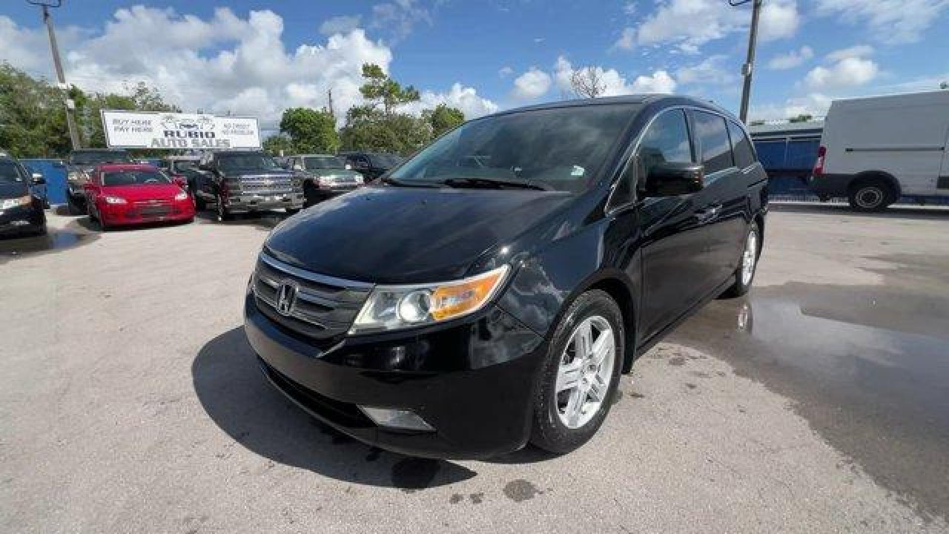 2013 Black Honda Odyssey (5FNRL5H97DB) with an 6 3.5L engine, Automatic transmission, located at 27610 S Dixie Hwy, Homestead, FL, 33032, (305) 749-2348, 25.510241, -80.438301 - KBB.com 10 Best Family Cars. Only 119,824 Miles! Boasts 28 Highway MPG and 19 City MPG! This Honda Odyssey boasts a Gas V6 3.5L/212 engine powering this Automatic transmission. XM Radio (subscription required), Wide-mode adjustable 2nd-row seats -inc: leather trimmed outboard seats, multi-function c - Photo#0