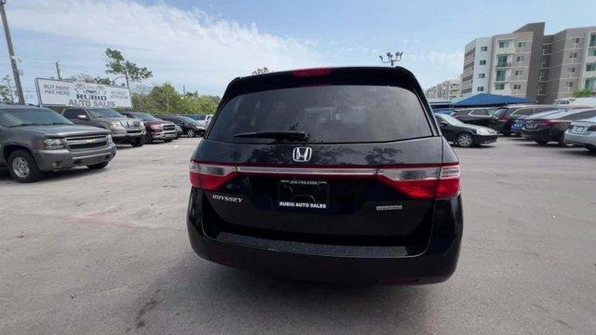 2013 Black Honda Odyssey (5FNRL5H97DB) with an 6 3.5L engine, Automatic transmission, located at 27610 S Dixie Hwy, Homestead, FL, 33032, (305) 749-2348, 25.510241, -80.438301 - KBB.com 10 Best Family Cars. Only 119,824 Miles! Boasts 28 Highway MPG and 19 City MPG! This Honda Odyssey boasts a Gas V6 3.5L/212 engine powering this Automatic transmission. XM Radio (subscription required), Wide-mode adjustable 2nd-row seats -inc: leather trimmed outboard seats, multi-function c - Photo#3