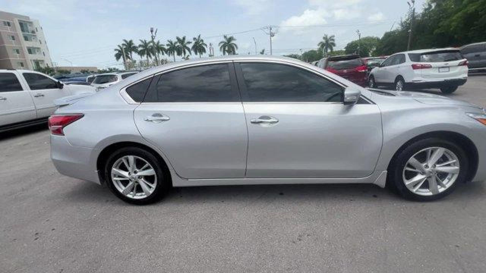 2014 Brilliant Silver Metallic /Charcoal Nissan Altima 2.5 SL (1N4AL3APXEC) with an 4 2.5 L engine, Variable transmission, located at 27610 S Dixie Hwy, Homestead, FL, 33032, (305) 749-2348, 25.510241, -80.438301 - IIHS Top Safety Pick. Scores 38 Highway MPG and 27 City MPG! This Nissan Altima boasts a Regular Unleaded I-4 2.5 L/152 engine powering this Variable transmission. CHARCOAL, LEATHER-APPOINTED SEAT TRIM, BRILLIANT SILVER METALLIC, [Z66] ACTIVATION DISCLAIMER.*This Nissan Altima Comes Equipped with Th - Photo#5