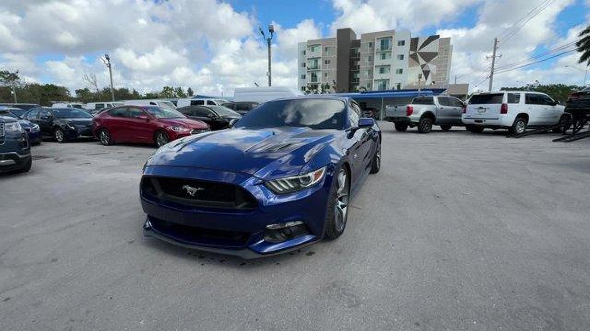 2015 Blue Ford Mustang GT Premium (1FA6P8CFXF5) with an 8 5.0 L engine, Automatic transmission, located at 27610 S Dixie Hwy, Homestead, FL, 33032, (305) 749-2348, 25.510241, -80.438301 - KBB.com Best Buy Awards Finalist. Only 92,923 Miles! Scores 25 Highway MPG and 15 City MPG! This Ford Mustang boasts a Premium Unleaded V-8 5.0 L/302 engine powering this Automatic transmission. Wheels: 18 x 8 Magnetic Painted/Machined -inc: Aluminum, Trunk Rear Cargo Access, Trip Computer.*This For - Photo#0