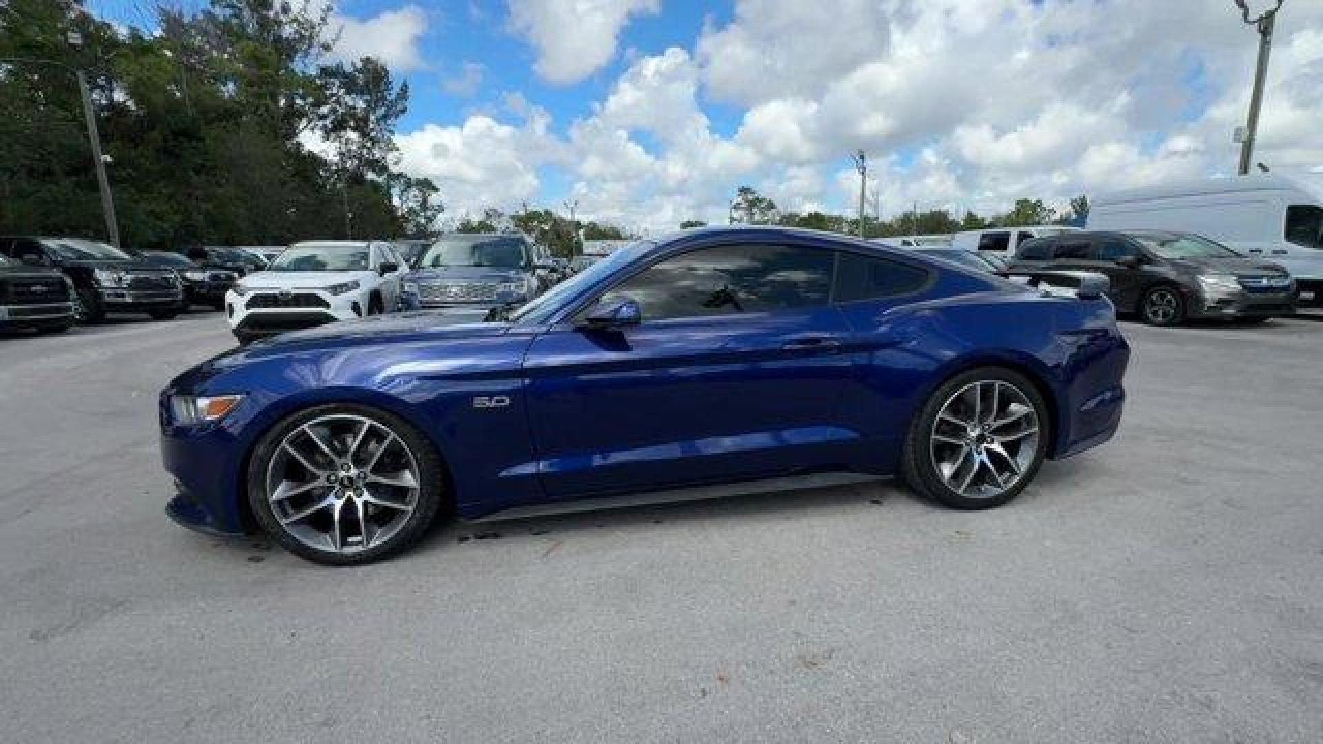 2015 Blue Ford Mustang GT Premium (1FA6P8CFXF5) with an 8 5.0 L engine, Automatic transmission, located at 27610 S Dixie Hwy, Homestead, FL, 33032, (305) 749-2348, 25.510241, -80.438301 - KBB.com Best Buy Awards Finalist. Only 92,923 Miles! Scores 25 Highway MPG and 15 City MPG! This Ford Mustang boasts a Premium Unleaded V-8 5.0 L/302 engine powering this Automatic transmission. Wheels: 18 x 8 Magnetic Painted/Machined -inc: Aluminum, Trunk Rear Cargo Access, Trip Computer.*This For - Photo#1