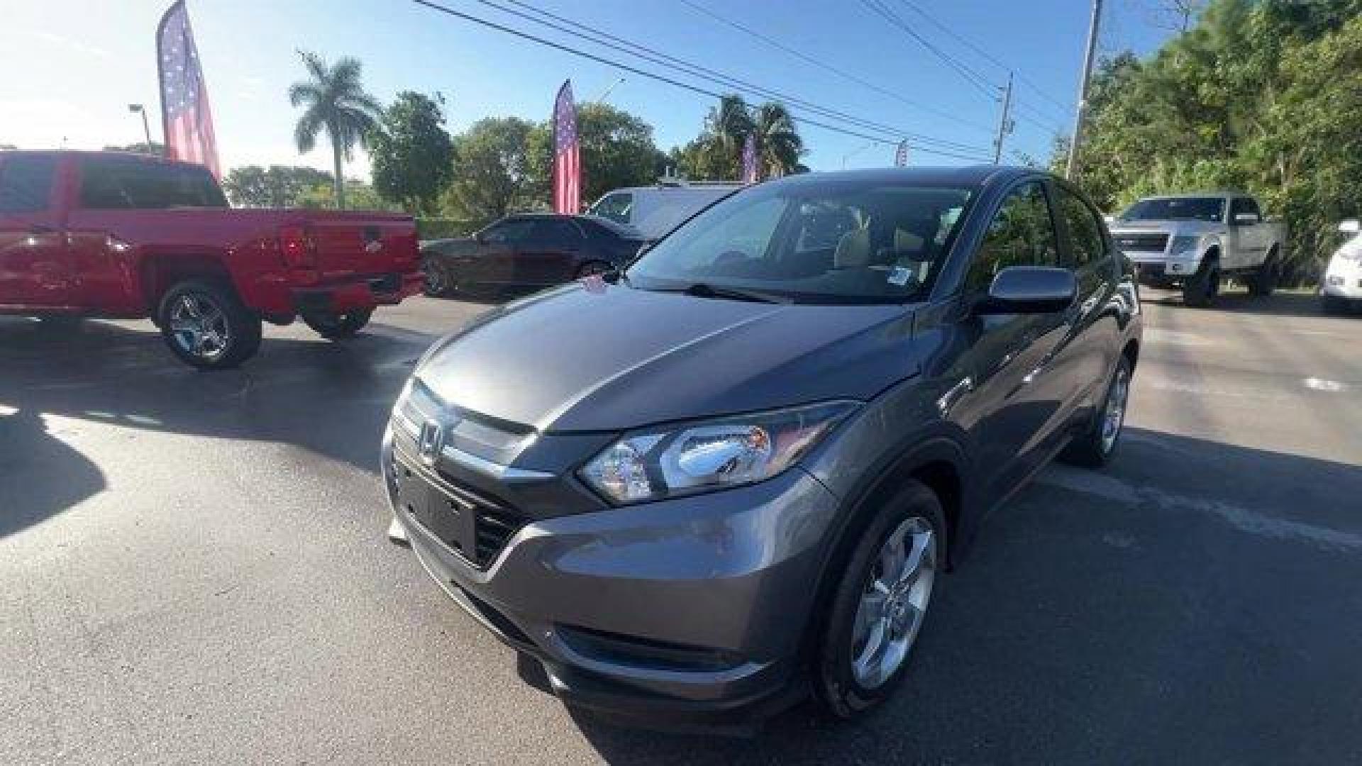 2018 Gray Honda HR-V LX 2WD CVT (3CZRU5H39JG) with an 4 1.8 L engine, Variable transmission, located at 27610 S Dixie Hwy, Homestead, FL, 33032, (305) 749-2348, 25.510241, -80.438301 - KBB.com 10 Most Awarded Brands. Only 70,359 Miles! Boasts 34 Highway MPG and 28 City MPG! This Honda HR-V delivers a Regular Unleaded I-4 1.8 L/110 engine powering this Variable transmission. Wheels: 17 Machine-Finished Alloy w/Silver Insert, VSA Electronic Stability Control (ESC), Urethane Gear Shi - Photo#0