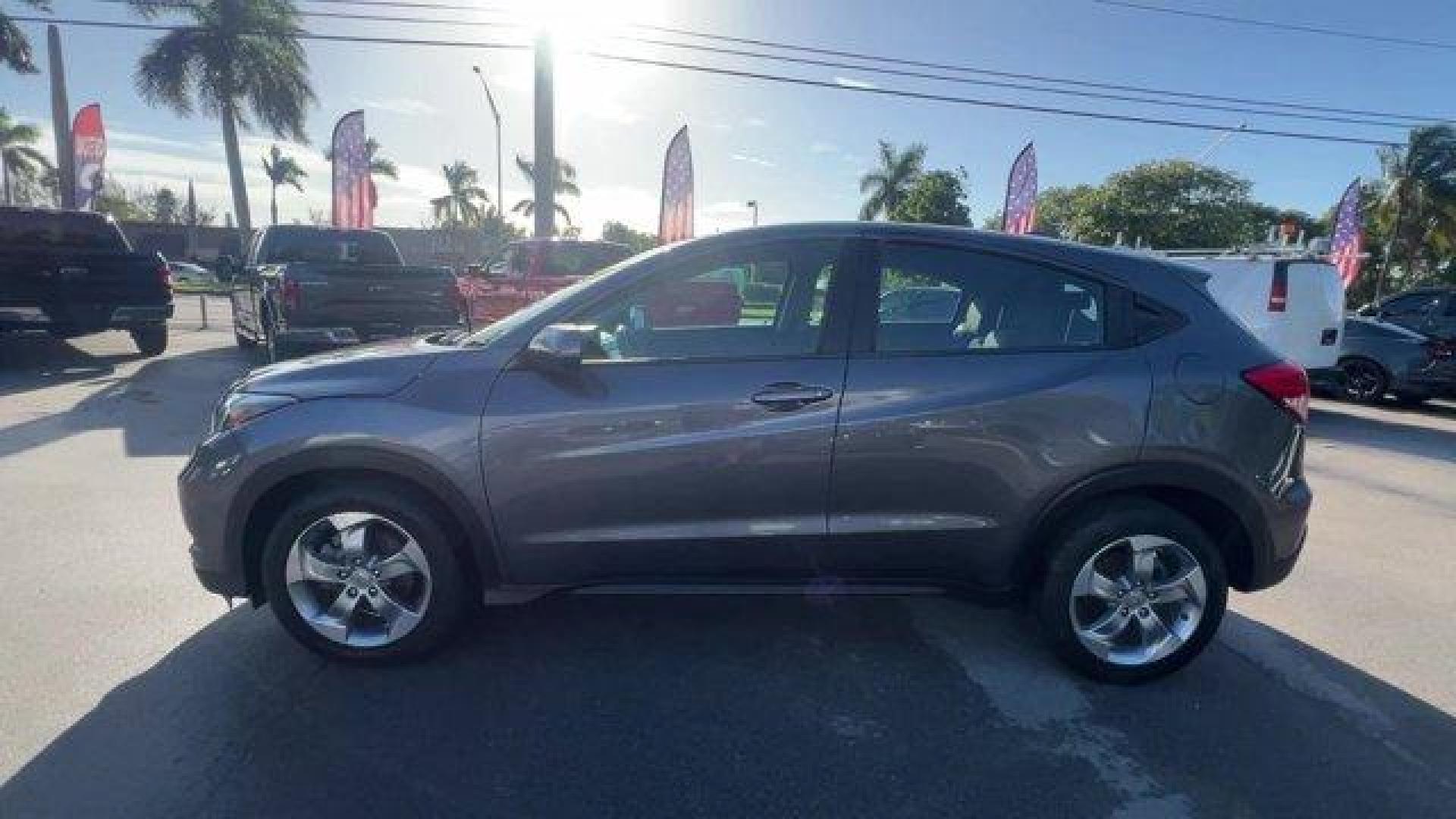 2018 Gray Honda HR-V LX 2WD CVT (3CZRU5H39JG) with an 4 1.8 L engine, Variable transmission, located at 27610 S Dixie Hwy, Homestead, FL, 33032, (305) 749-2348, 25.510241, -80.438301 - KBB.com 10 Most Awarded Brands. Only 70,359 Miles! Boasts 34 Highway MPG and 28 City MPG! This Honda HR-V delivers a Regular Unleaded I-4 1.8 L/110 engine powering this Variable transmission. Wheels: 17 Machine-Finished Alloy w/Silver Insert, VSA Electronic Stability Control (ESC), Urethane Gear Shi - Photo#1