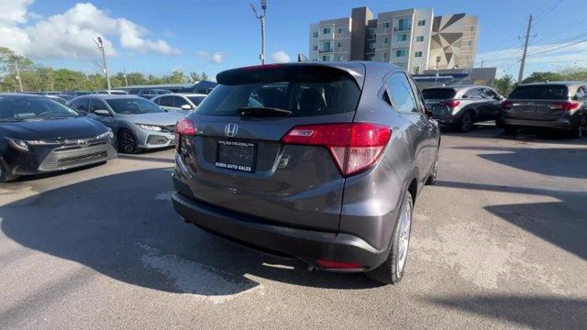 2018 Gray Honda HR-V LX 2WD CVT (3CZRU5H39JG) with an 4 1.8 L engine, Variable transmission, located at 27610 S Dixie Hwy, Homestead, FL, 33032, (305) 749-2348, 25.510241, -80.438301 - KBB.com 10 Most Awarded Brands. Only 70,359 Miles! Boasts 34 Highway MPG and 28 City MPG! This Honda HR-V delivers a Regular Unleaded I-4 1.8 L/110 engine powering this Variable transmission. Wheels: 17 Machine-Finished Alloy w/Silver Insert, VSA Electronic Stability Control (ESC), Urethane Gear Shi - Photo#4