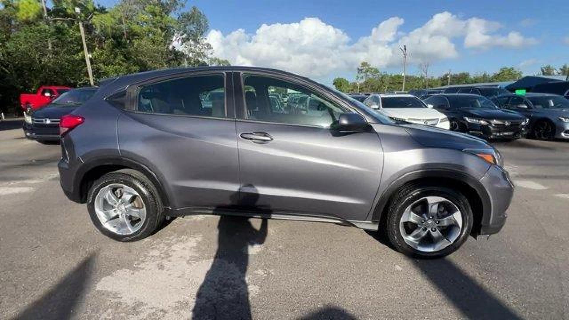 2018 Gray Honda HR-V LX 2WD CVT (3CZRU5H39JG) with an 4 1.8 L engine, Variable transmission, located at 27610 S Dixie Hwy, Homestead, FL, 33032, (305) 749-2348, 25.510241, -80.438301 - KBB.com 10 Most Awarded Brands. Only 70,359 Miles! Boasts 34 Highway MPG and 28 City MPG! This Honda HR-V delivers a Regular Unleaded I-4 1.8 L/110 engine powering this Variable transmission. Wheels: 17 Machine-Finished Alloy w/Silver Insert, VSA Electronic Stability Control (ESC), Urethane Gear Shi - Photo#5