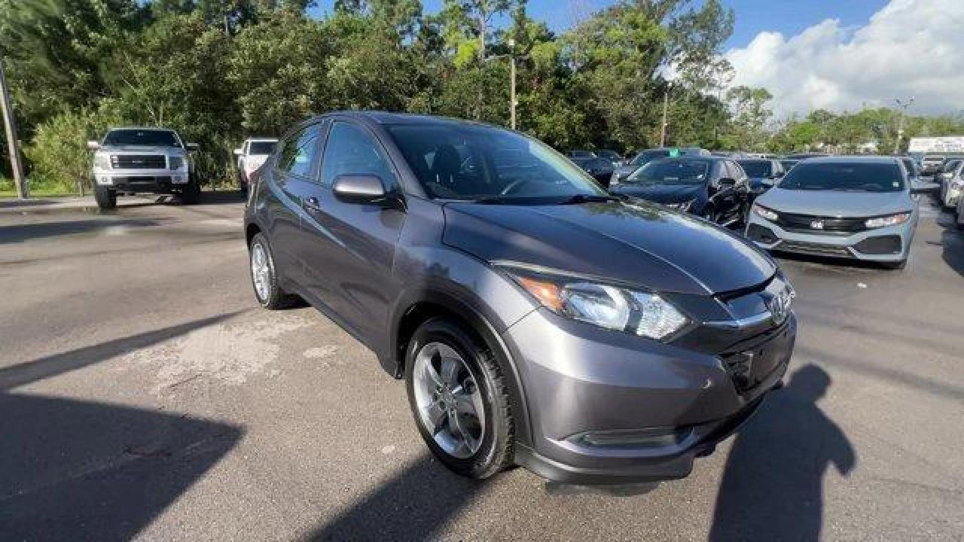 2018 Gray Honda HR-V LX 2WD CVT (3CZRU5H39JG) with an 4 1.8 L engine, Variable transmission, located at 27610 S Dixie Hwy, Homestead, FL, 33032, (305) 749-2348, 25.510241, -80.438301 - KBB.com 10 Most Awarded Brands. Only 70,359 Miles! Boasts 34 Highway MPG and 28 City MPG! This Honda HR-V delivers a Regular Unleaded I-4 1.8 L/110 engine powering this Variable transmission. Wheels: 17 Machine-Finished Alloy w/Silver Insert, VSA Electronic Stability Control (ESC), Urethane Gear Shi - Photo#6