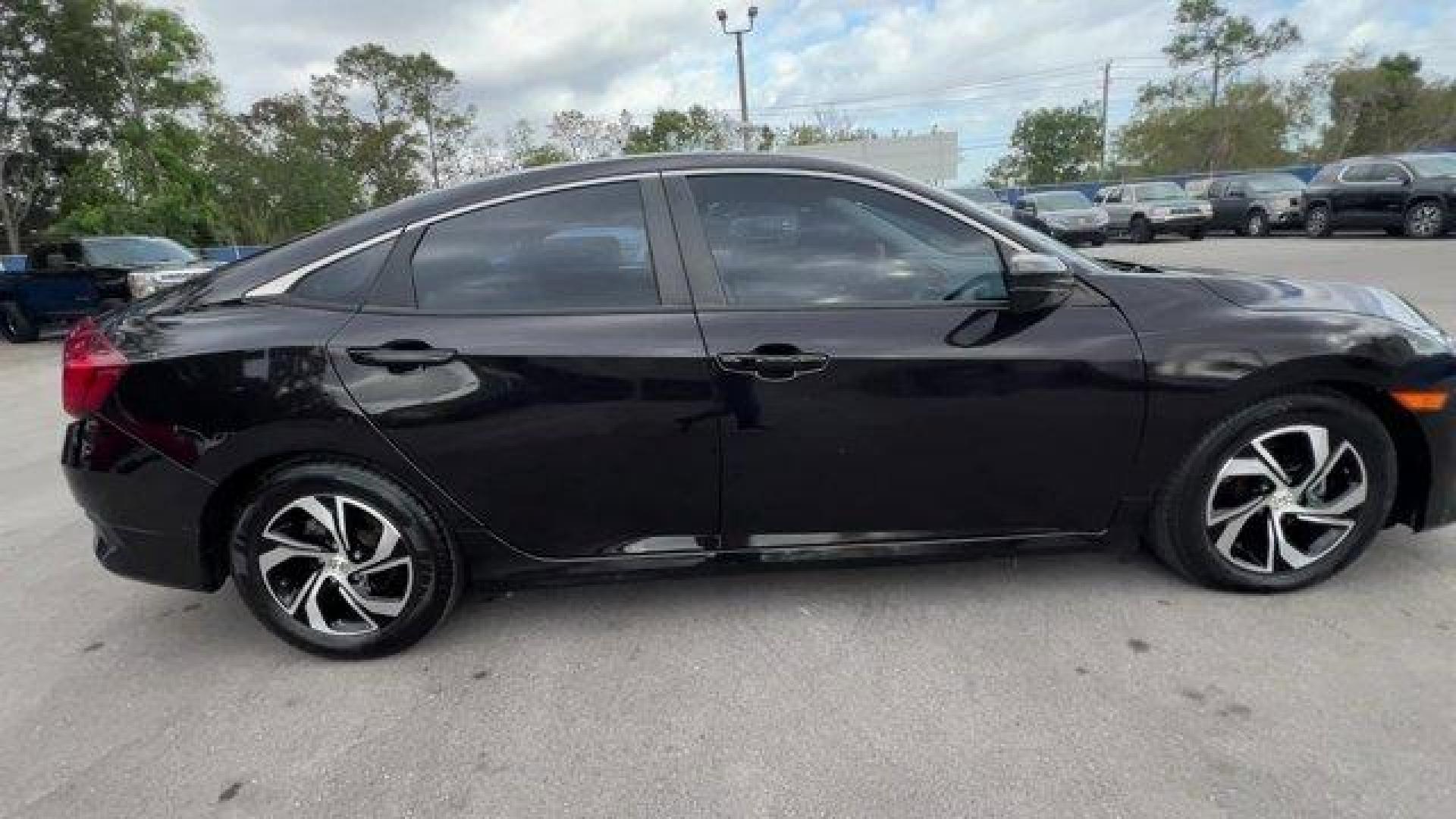 2017 Black Honda Civic Sedan LX (19XFC2F56HE) with an 4 2.0 L engine, Variable transmission, located at 27610 S Dixie Hwy, Homestead, FL, 33032, (305) 749-2348, 25.510241, -80.438301 - IIHS Top Safety Pick. Delivers 40 Highway MPG and 31 City MPG! This Honda Civic Sedan delivers a Regular Unleaded I-4 2.0 L/122 engine powering this Variable transmission. Wheels: 16 w/Full Covers, VSA Electronic Stability Control (ESC), Valet Function.*This Honda Civic Sedan Comes Equipped with The - Photo#3