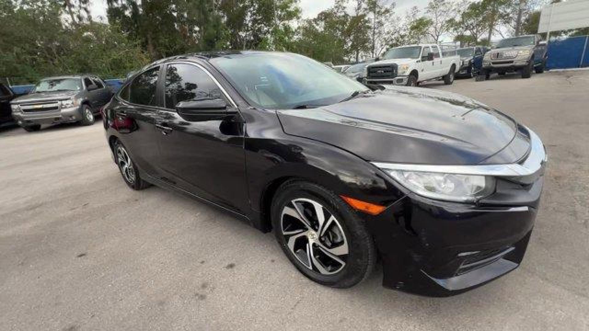 2017 Black Honda Civic Sedan LX (19XFC2F56HE) with an 4 2.0 L engine, Variable transmission, located at 27610 S Dixie Hwy, Homestead, FL, 33032, (305) 749-2348, 25.510241, -80.438301 - IIHS Top Safety Pick. Delivers 40 Highway MPG and 31 City MPG! This Honda Civic Sedan delivers a Regular Unleaded I-4 2.0 L/122 engine powering this Variable transmission. Wheels: 16 w/Full Covers, VSA Electronic Stability Control (ESC), Valet Function.*This Honda Civic Sedan Comes Equipped with The - Photo#4