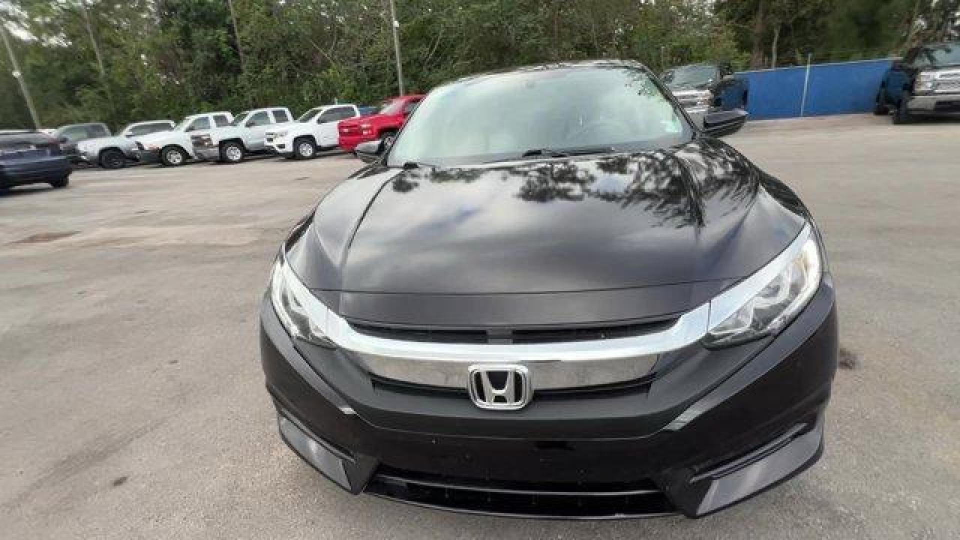 2017 Black Honda Civic Sedan LX (19XFC2F56HE) with an 4 2.0 L engine, Variable transmission, located at 27610 S Dixie Hwy, Homestead, FL, 33032, (305) 749-2348, 25.510241, -80.438301 - IIHS Top Safety Pick. Delivers 40 Highway MPG and 31 City MPG! This Honda Civic Sedan delivers a Regular Unleaded I-4 2.0 L/122 engine powering this Variable transmission. Wheels: 16 w/Full Covers, VSA Electronic Stability Control (ESC), Valet Function.*This Honda Civic Sedan Comes Equipped with The - Photo#5