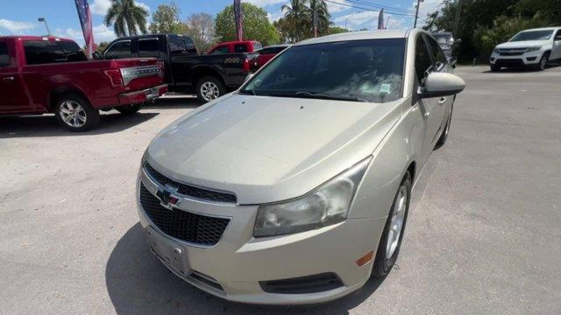 2014 Champagne Silver Metallic /Jet Black Chevrolet Cruze 1LT (1G1PD5SBXE7) with an 4 1.4L engine, Manual transmission, located at 27610 S Dixie Hwy, Homestead, FL, 33032, (305) 749-2348, 25.510241, -80.438301 - KBB.com 10 Best Sedans Under $25,000. Delivers 38 Highway MPG and 26 City MPG! This Chevrolet Cruze boasts a Turbocharged Gas I4 1.4L/83 engine powering this Manual transmission. TRANSMISSION, 6-SPEED MANUAL WITH OVERDRIVE, TECHNOLOGY PACKAGE includes (UFU) Chevrolet MyLink radio, (UP9) Chevrolet My - Photo#0