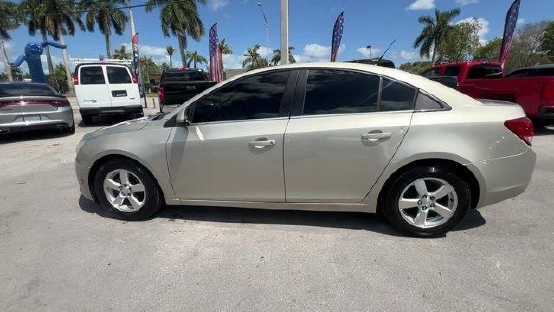 2014 Champagne Silver Metallic /Jet Black Chevrolet Cruze 1LT (1G1PD5SBXE7) with an 4 1.4L engine, Manual transmission, located at 27610 S Dixie Hwy, Homestead, FL, 33032, (305) 749-2348, 25.510241, -80.438301 - KBB.com 10 Best Sedans Under $25,000. Delivers 38 Highway MPG and 26 City MPG! This Chevrolet Cruze boasts a Turbocharged Gas I4 1.4L/83 engine powering this Manual transmission. TRANSMISSION, 6-SPEED MANUAL WITH OVERDRIVE, TECHNOLOGY PACKAGE includes (UFU) Chevrolet MyLink radio, (UP9) Chevrolet My - Photo#1