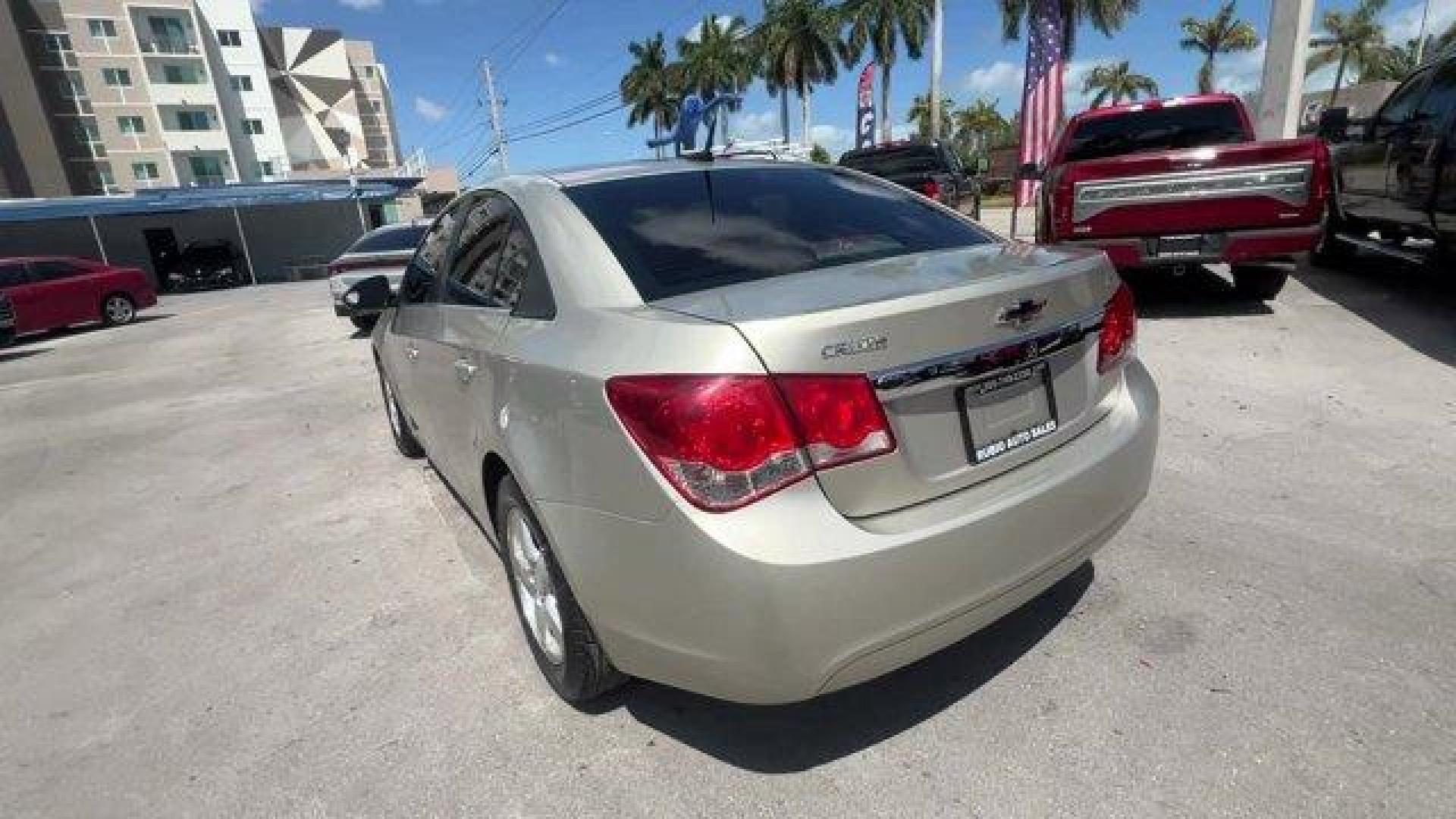 2014 Champagne Silver Metallic /Jet Black Chevrolet Cruze 1LT (1G1PD5SBXE7) with an 4 1.4L engine, Manual transmission, located at 27610 S Dixie Hwy, Homestead, FL, 33032, (305) 749-2348, 25.510241, -80.438301 - KBB.com 10 Best Sedans Under $25,000. Delivers 38 Highway MPG and 26 City MPG! This Chevrolet Cruze boasts a Turbocharged Gas I4 1.4L/83 engine powering this Manual transmission. TRANSMISSION, 6-SPEED MANUAL WITH OVERDRIVE, TECHNOLOGY PACKAGE includes (UFU) Chevrolet MyLink radio, (UP9) Chevrolet My - Photo#2