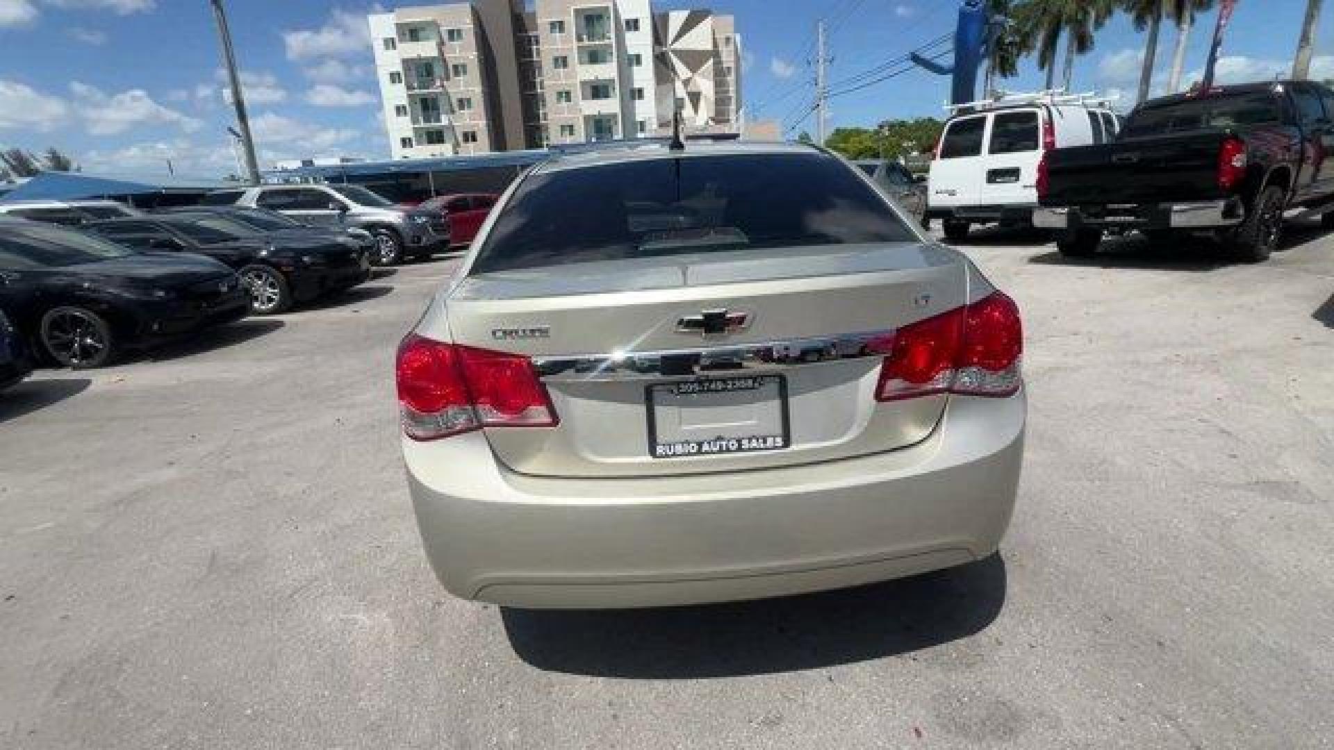 2014 Champagne Silver Metallic /Jet Black Chevrolet Cruze 1LT (1G1PD5SBXE7) with an 4 1.4L engine, Manual transmission, located at 27610 S Dixie Hwy, Homestead, FL, 33032, (305) 749-2348, 25.510241, -80.438301 - KBB.com 10 Best Sedans Under $25,000. Delivers 38 Highway MPG and 26 City MPG! This Chevrolet Cruze boasts a Turbocharged Gas I4 1.4L/83 engine powering this Manual transmission. TRANSMISSION, 6-SPEED MANUAL WITH OVERDRIVE, TECHNOLOGY PACKAGE includes (UFU) Chevrolet MyLink radio, (UP9) Chevrolet My - Photo#3