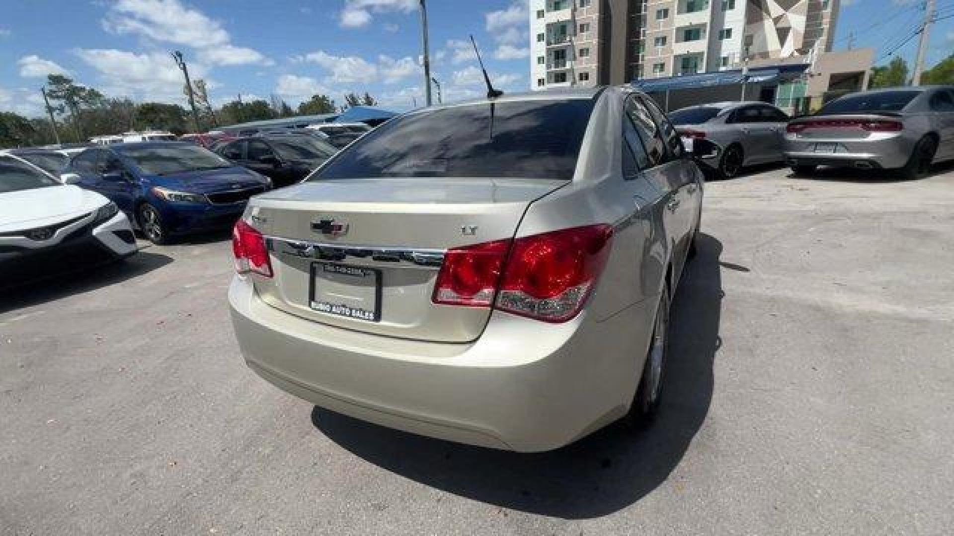 2014 Champagne Silver Metallic /Jet Black Chevrolet Cruze 1LT (1G1PD5SBXE7) with an 4 1.4L engine, Manual transmission, located at 27610 S Dixie Hwy, Homestead, FL, 33032, (305) 749-2348, 25.510241, -80.438301 - KBB.com 10 Best Sedans Under $25,000. Delivers 38 Highway MPG and 26 City MPG! This Chevrolet Cruze boasts a Turbocharged Gas I4 1.4L/83 engine powering this Manual transmission. TRANSMISSION, 6-SPEED MANUAL WITH OVERDRIVE, TECHNOLOGY PACKAGE includes (UFU) Chevrolet MyLink radio, (UP9) Chevrolet My - Photo#4