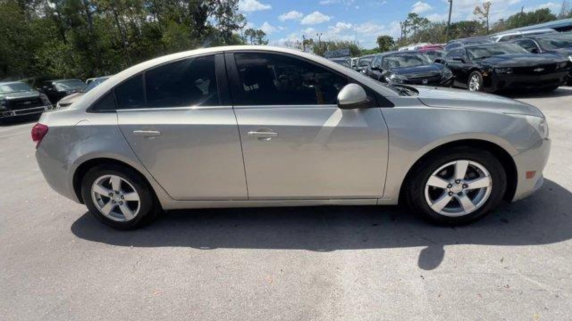 2014 Champagne Silver Metallic /Jet Black Chevrolet Cruze 1LT (1G1PD5SBXE7) with an 4 1.4L engine, Manual transmission, located at 27610 S Dixie Hwy, Homestead, FL, 33032, (305) 749-2348, 25.510241, -80.438301 - KBB.com 10 Best Sedans Under $25,000. Delivers 38 Highway MPG and 26 City MPG! This Chevrolet Cruze boasts a Turbocharged Gas I4 1.4L/83 engine powering this Manual transmission. TRANSMISSION, 6-SPEED MANUAL WITH OVERDRIVE, TECHNOLOGY PACKAGE includes (UFU) Chevrolet MyLink radio, (UP9) Chevrolet My - Photo#5