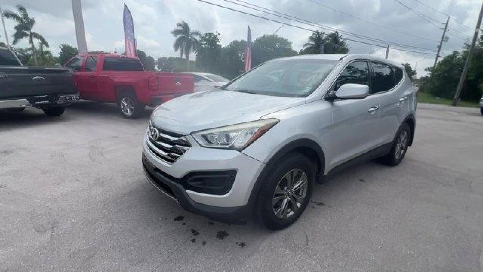 2014 Moonstone Silver /Gray Hyundai Santa Fe Sport Sport 2.4 FWD (5XYZT3LB0EG) with an 4 2.4 L engine, Automatic transmission, located at 27610 S Dixie Hwy, Homestead, FL, 33032, (305) 749-2348, 25.510241, -80.438301 - Boasts 27 Highway MPG and 20 City MPG! This Hyundai Santa Fe Sport delivers a Regular Unleaded I-4 2.4 L/144 engine powering this Automatic transmission. WHEEL LOCKS, REMOTE ENGINE START, OPTION GROUP 01 -inc: standard equipment.*This Hyundai Santa Fe Sport Comes Equipped with These Options *MUDGUAR - Photo#0