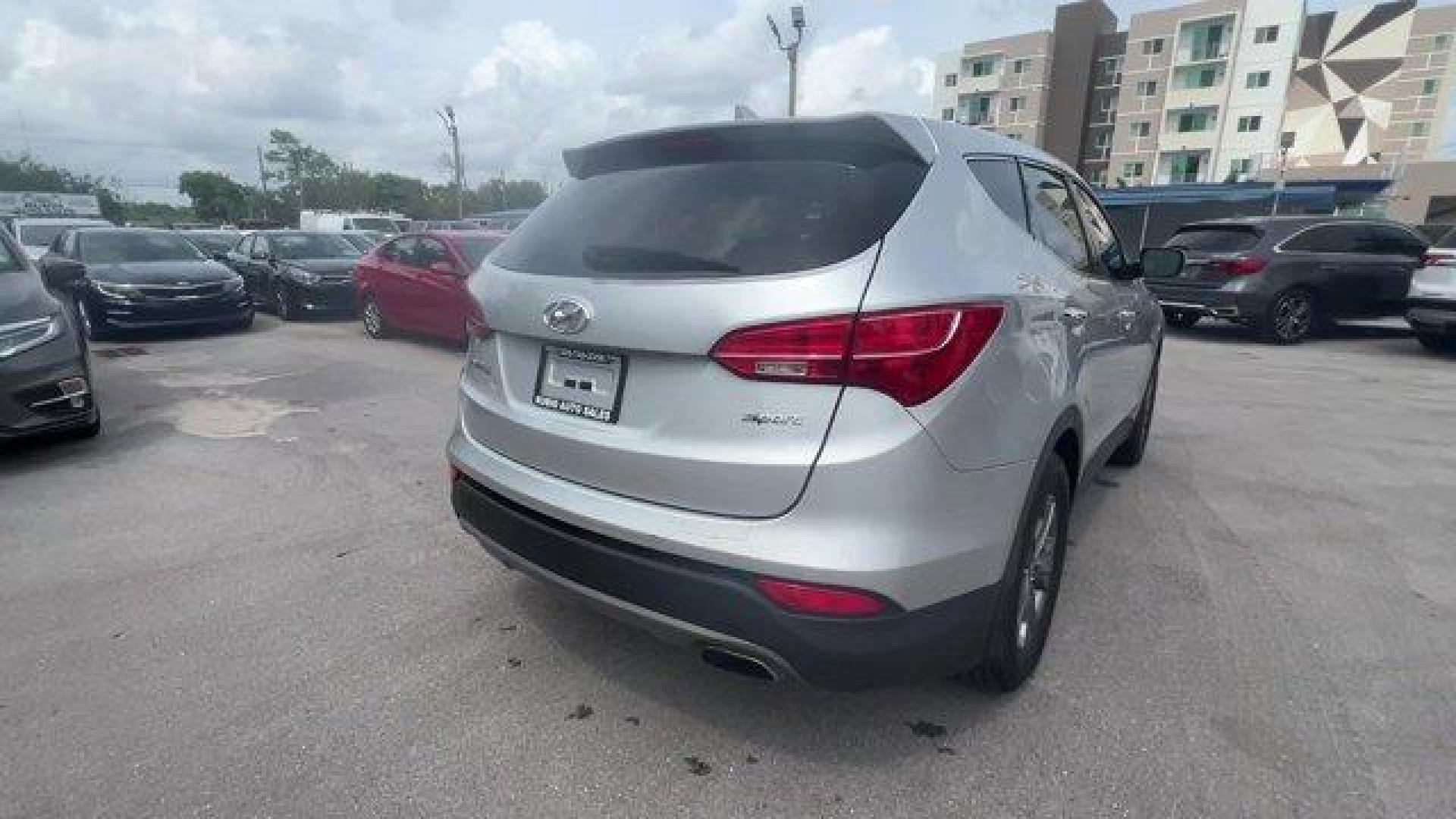 2014 Moonstone Silver /Gray Hyundai Santa Fe Sport Sport 2.4 FWD (5XYZT3LB0EG) with an 4 2.4 L engine, Automatic transmission, located at 27610 S Dixie Hwy, Homestead, FL, 33032, (305) 749-2348, 25.510241, -80.438301 - Boasts 27 Highway MPG and 20 City MPG! This Hyundai Santa Fe Sport delivers a Regular Unleaded I-4 2.4 L/144 engine powering this Automatic transmission. WHEEL LOCKS, REMOTE ENGINE START, OPTION GROUP 01 -inc: standard equipment.*This Hyundai Santa Fe Sport Comes Equipped with These Options *MUDGUAR - Photo#4