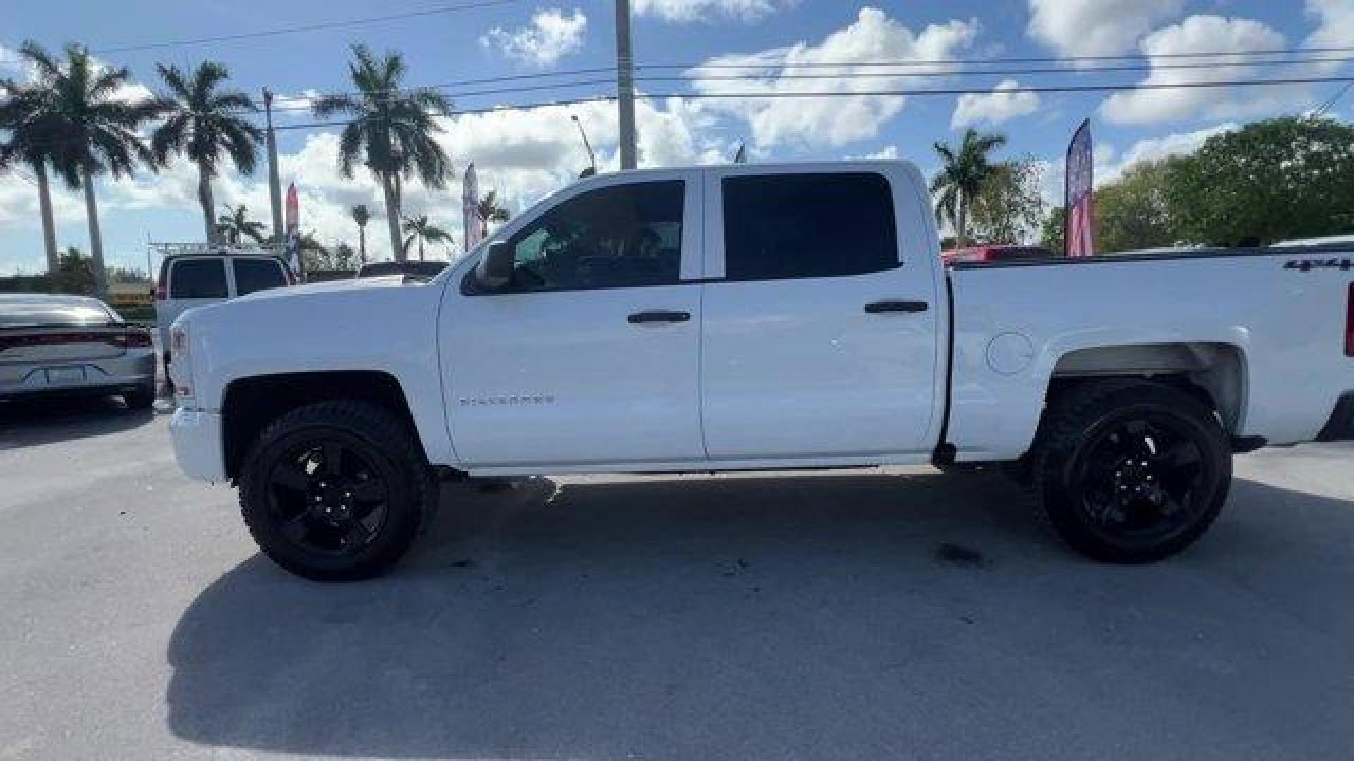 2017 Summit White /Jet Black Chevrolet Silverado 1500 LS Crew Cab Short Box 4WD (3GCUKNEH0HG) with an 6 4.3L engine, Automatic transmission, located at 27610 S Dixie Hwy, Homestead, FL, 33032, (305) 749-2348, 25.510241, -80.438301 - KBB.com 10 Most Awarded Brands. Delivers 22 Highway MPG and 17 City MPG! This Chevrolet Silverado 1500 boasts a Gas/Ethanol V6 4.3L/262 engine powering this Automatic transmission. WHEELS, 17 X 8 (43.2 CM X 20.3 CM) STAINLESS STEEL CLAD (STD), TRANSMISSION, 6-SPEED AUTOMATIC, ELECTRONICALLY CONTROLL - Photo#1