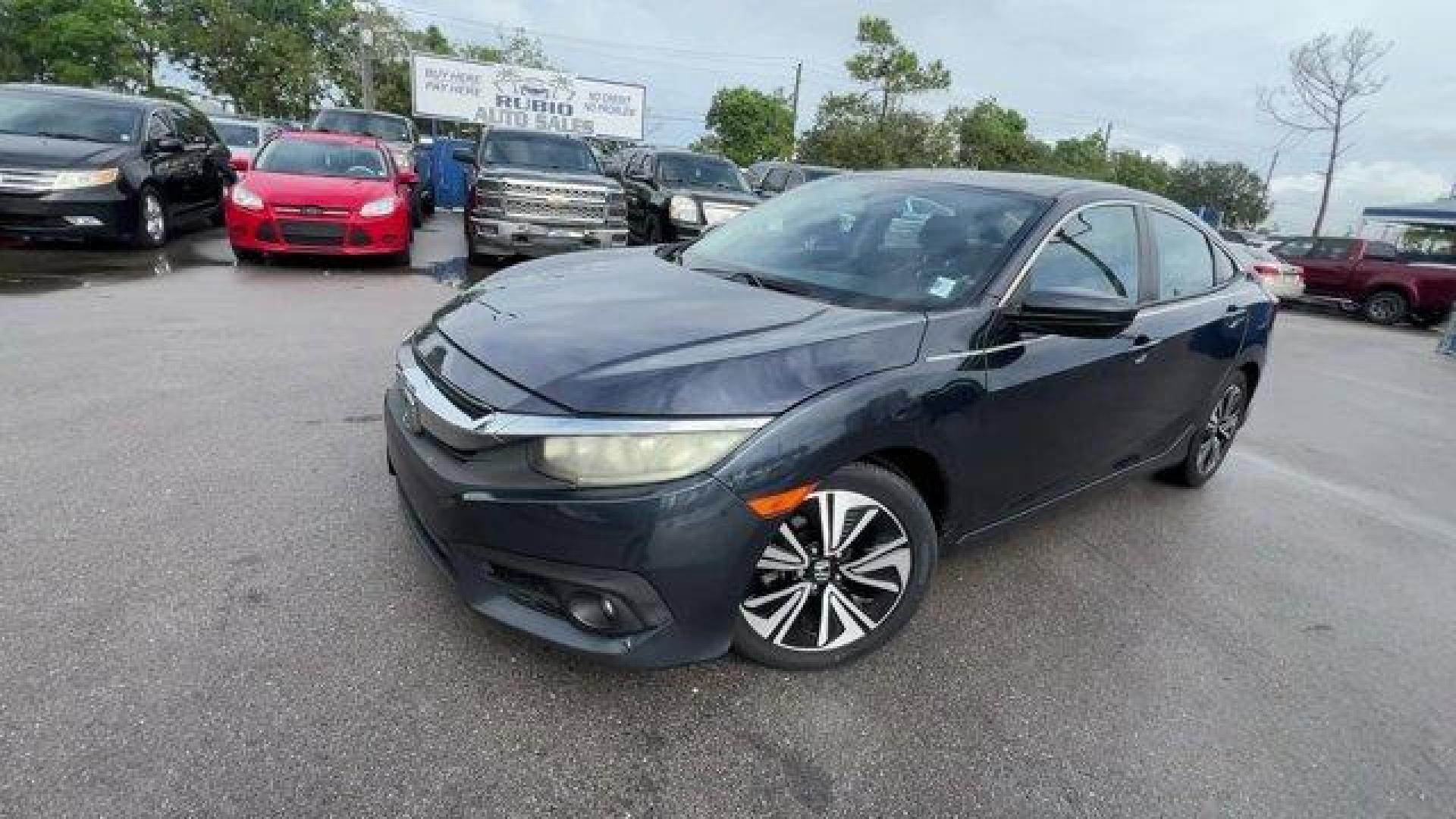 2016 Gray Honda Civic Sedan EX-T (19XFC1F30GE) with an 4 1.5 L engine, Variable transmission, located at 27610 S Dixie Hwy, Homestead, FL, 33032, (305) 749-2348, 25.510241, -80.438301 - IIHS Top Safety Pick+. Delivers 42 Highway MPG and 31 City MPG! This Honda Civic Sedan delivers a Intercooled Turbo Regular Unleaded I-4 1.5 L/91 engine powering this Variable transmission. Wheels: 17 Alloy, Wheels w/Silver Accents, VSA Electronic Stability Control (ESC).*This Honda Civic Sedan Come - Photo#0