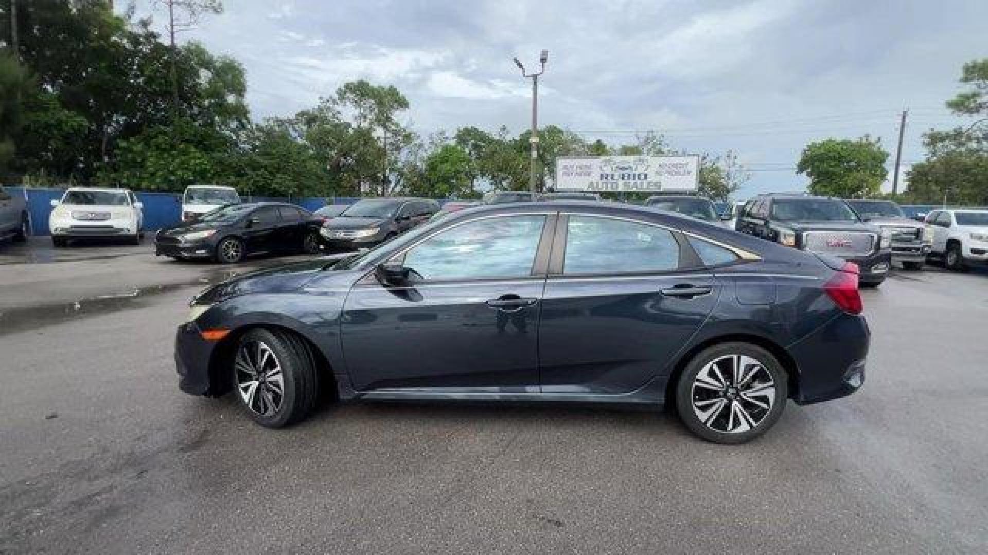 2016 Gray Honda Civic Sedan EX-T (19XFC1F30GE) with an 4 1.5 L engine, Variable transmission, located at 27610 S Dixie Hwy, Homestead, FL, 33032, (305) 749-2348, 25.510241, -80.438301 - IIHS Top Safety Pick+. Delivers 42 Highway MPG and 31 City MPG! This Honda Civic Sedan delivers a Intercooled Turbo Regular Unleaded I-4 1.5 L/91 engine powering this Variable transmission. Wheels: 17 Alloy, Wheels w/Silver Accents, VSA Electronic Stability Control (ESC).*This Honda Civic Sedan Come - Photo#1