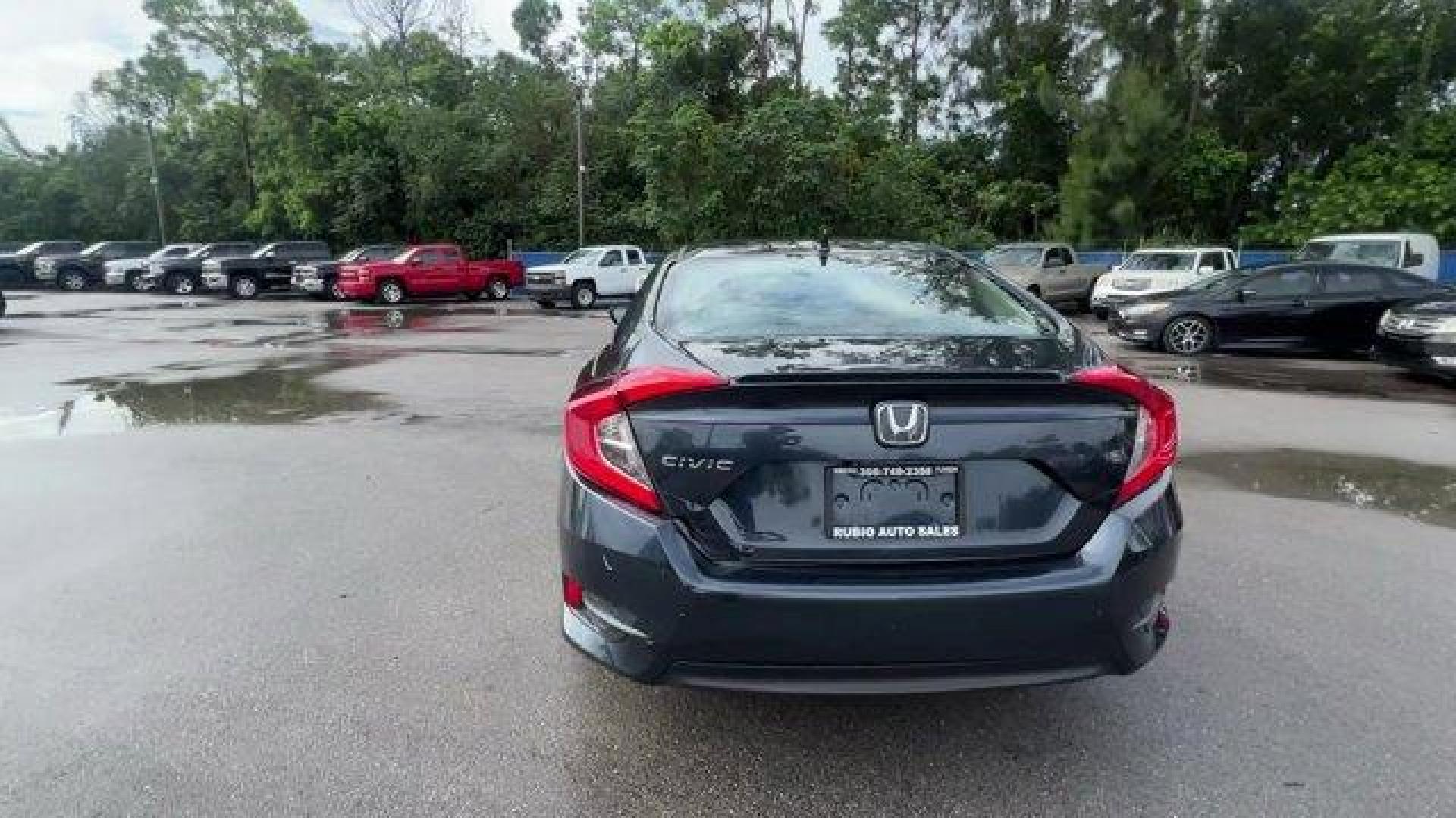 2016 Gray Honda Civic Sedan EX-T (19XFC1F30GE) with an 4 1.5 L engine, Variable transmission, located at 27610 S Dixie Hwy, Homestead, FL, 33032, (305) 749-2348, 25.510241, -80.438301 - IIHS Top Safety Pick+. Delivers 42 Highway MPG and 31 City MPG! This Honda Civic Sedan delivers a Intercooled Turbo Regular Unleaded I-4 1.5 L/91 engine powering this Variable transmission. Wheels: 17 Alloy, Wheels w/Silver Accents, VSA Electronic Stability Control (ESC).*This Honda Civic Sedan Come - Photo#3